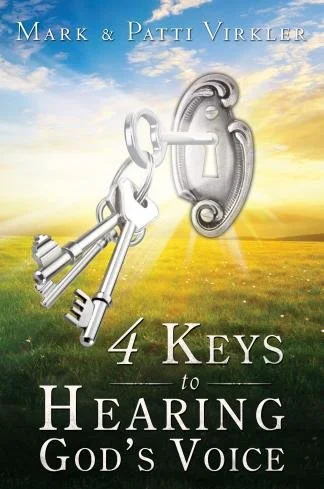 Book cover for "4 Keys to Hearing God's Voice" by Mark and Patti Virkler. The cover features three silver keys inserted into a silver keyhole against a background of a sunny field with a blue sky and clouds.