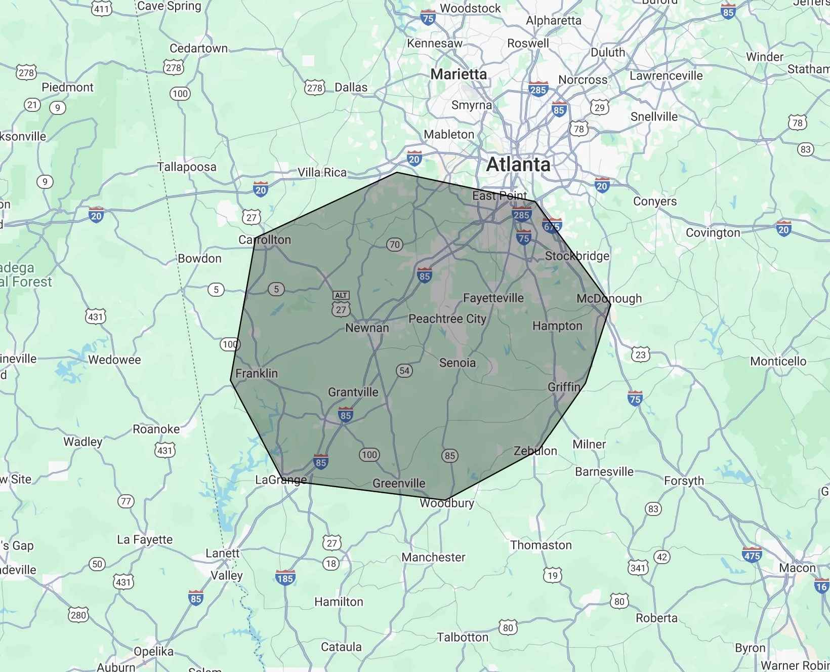 Map showing a black-outlined region centered around Atlanta, Georgia, covering surrounding cities including Carrollton, Newnan, Fayetteville, and LaGrange.