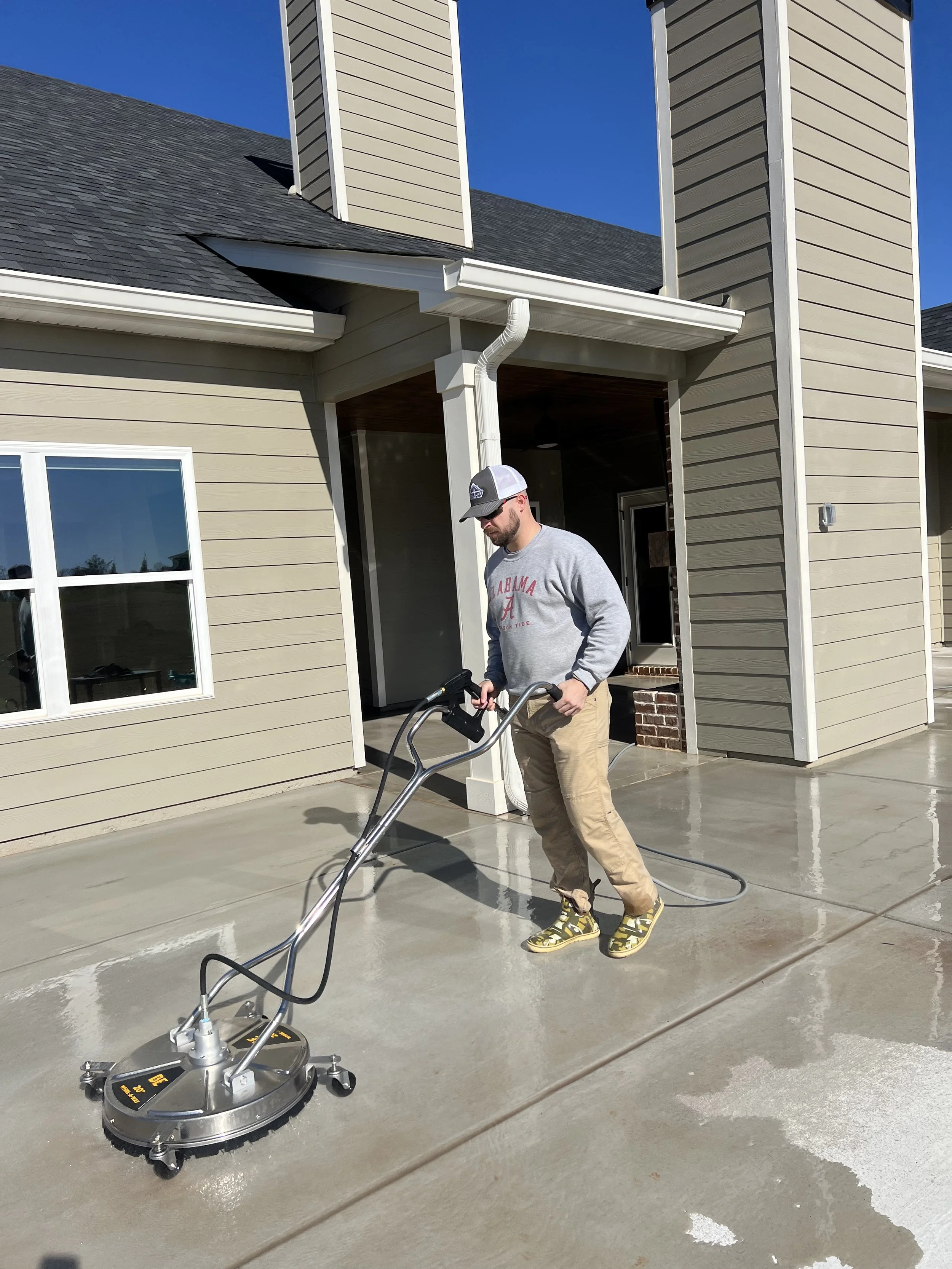 pressure washing a concrete patio using surface cleaner