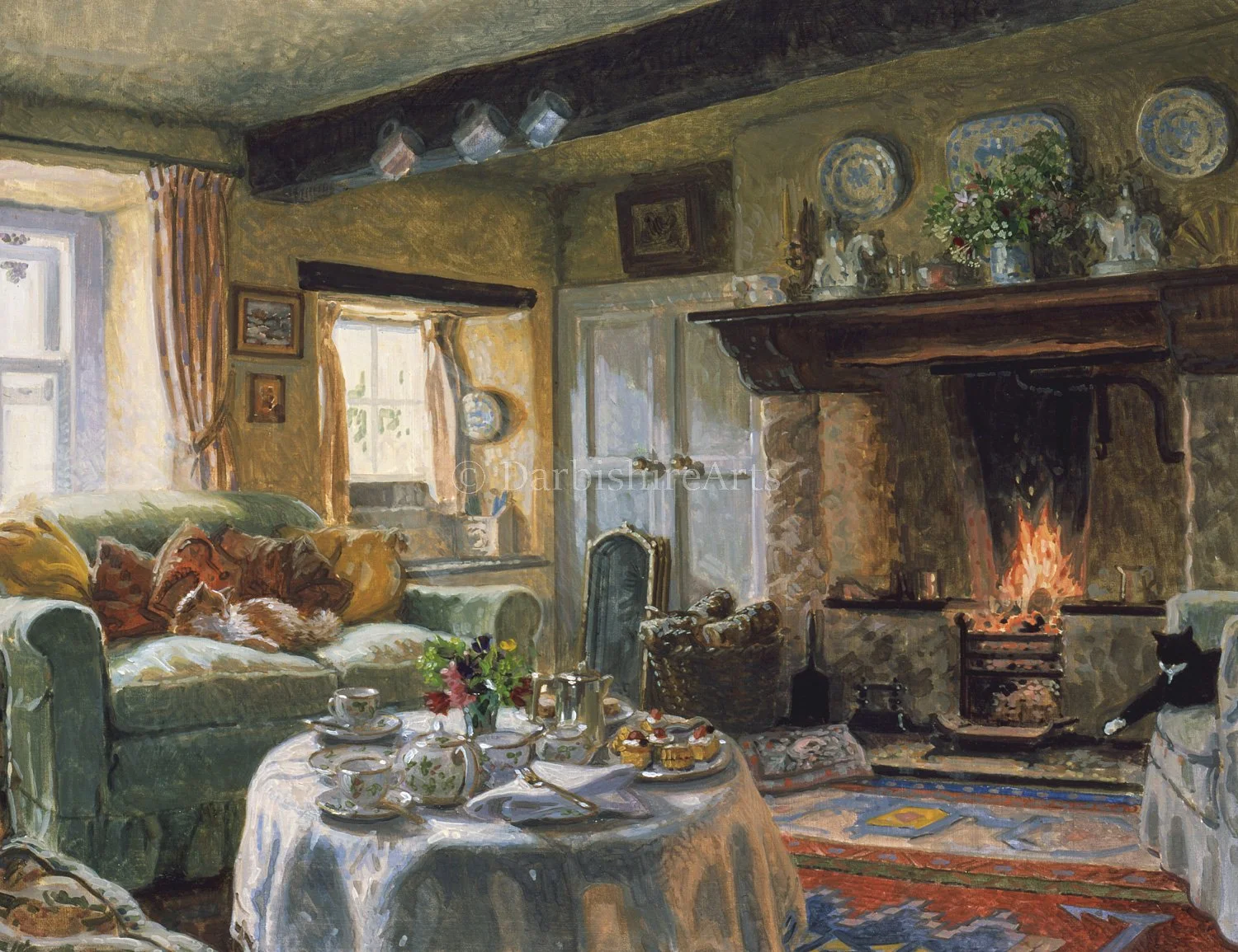 A cozy, traditional living room with a roaring fireplace, a green sofa with cushions, a round table set with tea, a vase of flowers, and a black cat sitting on an armchair.