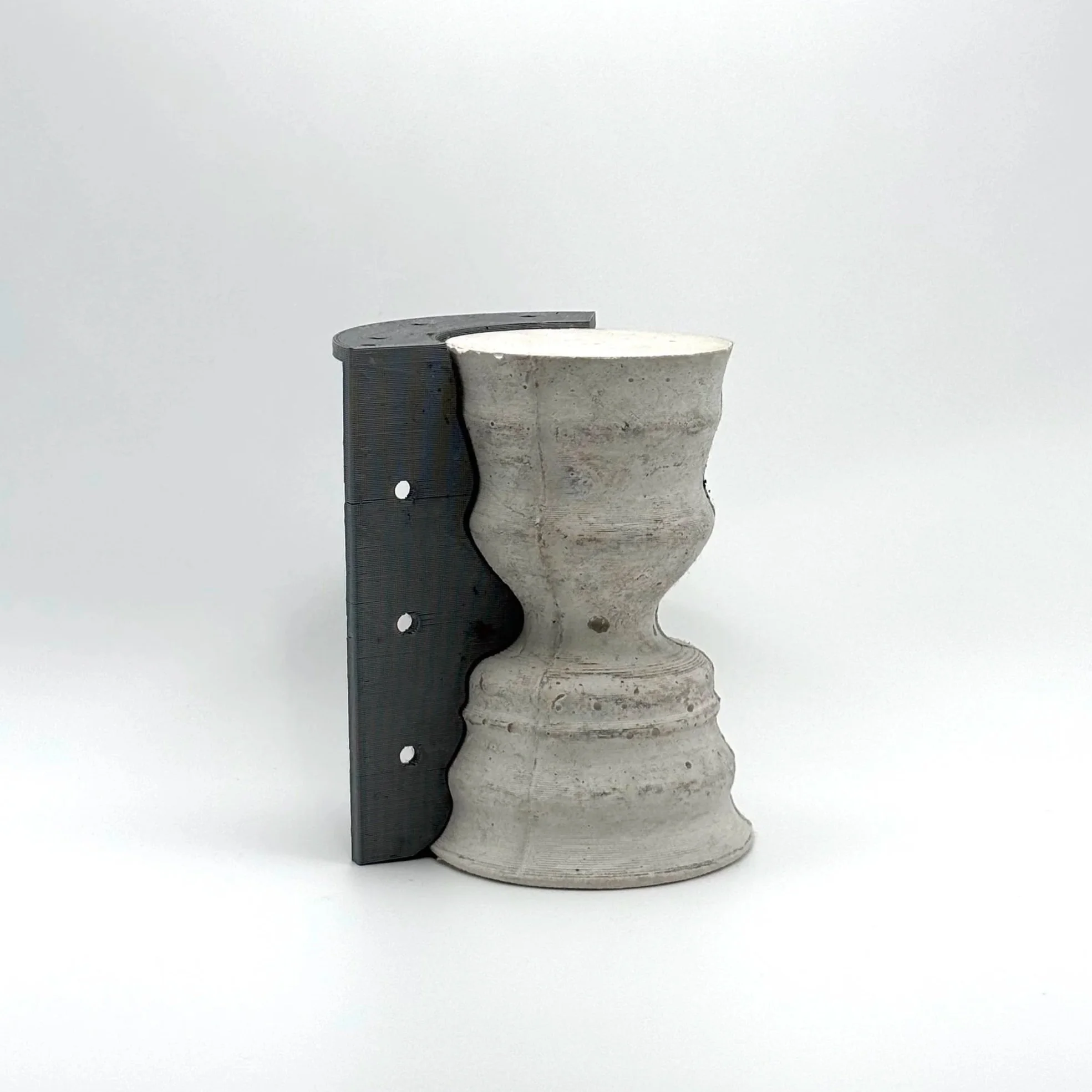 Concrete and metal object combining digital fabrication and handmade making