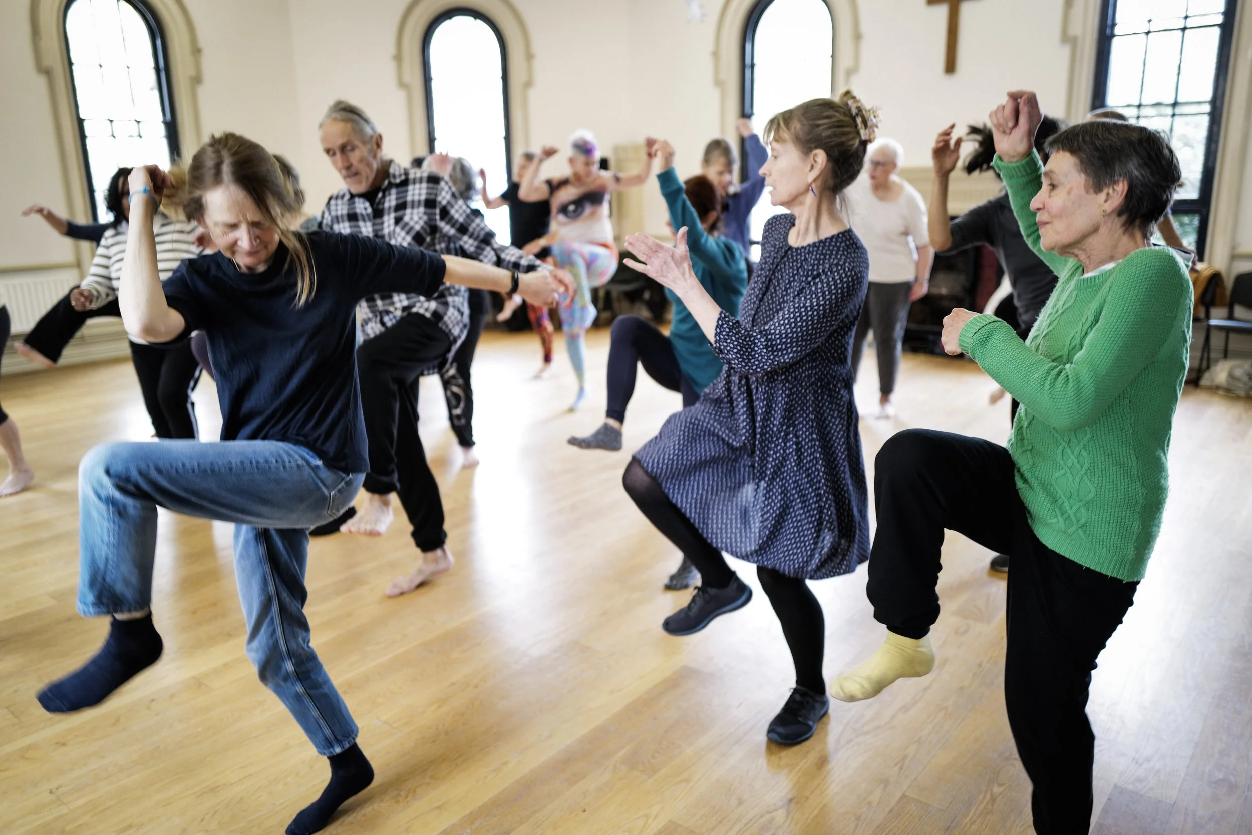 A group of men and women aged 50+ dancing together