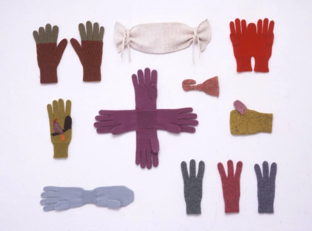 photograph of the gloves designed by the artist, each representing a different local character