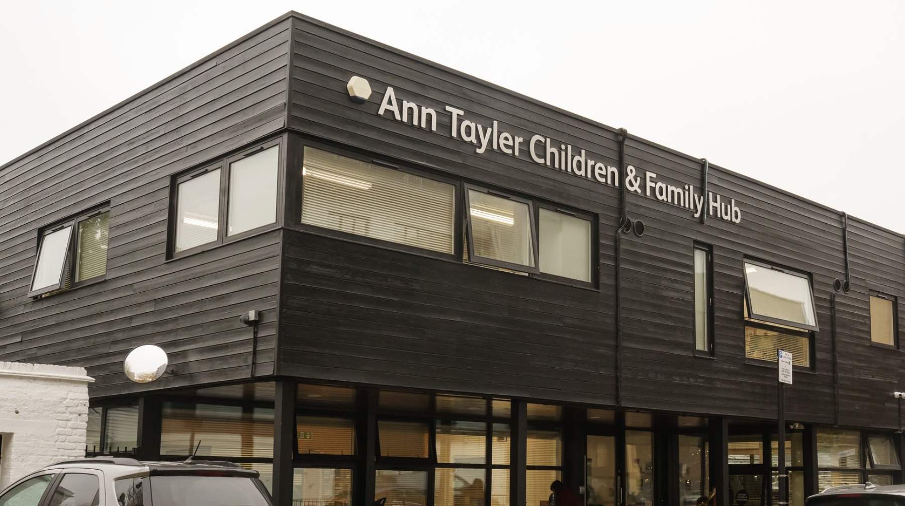 a building that says ann tayler children and family hub