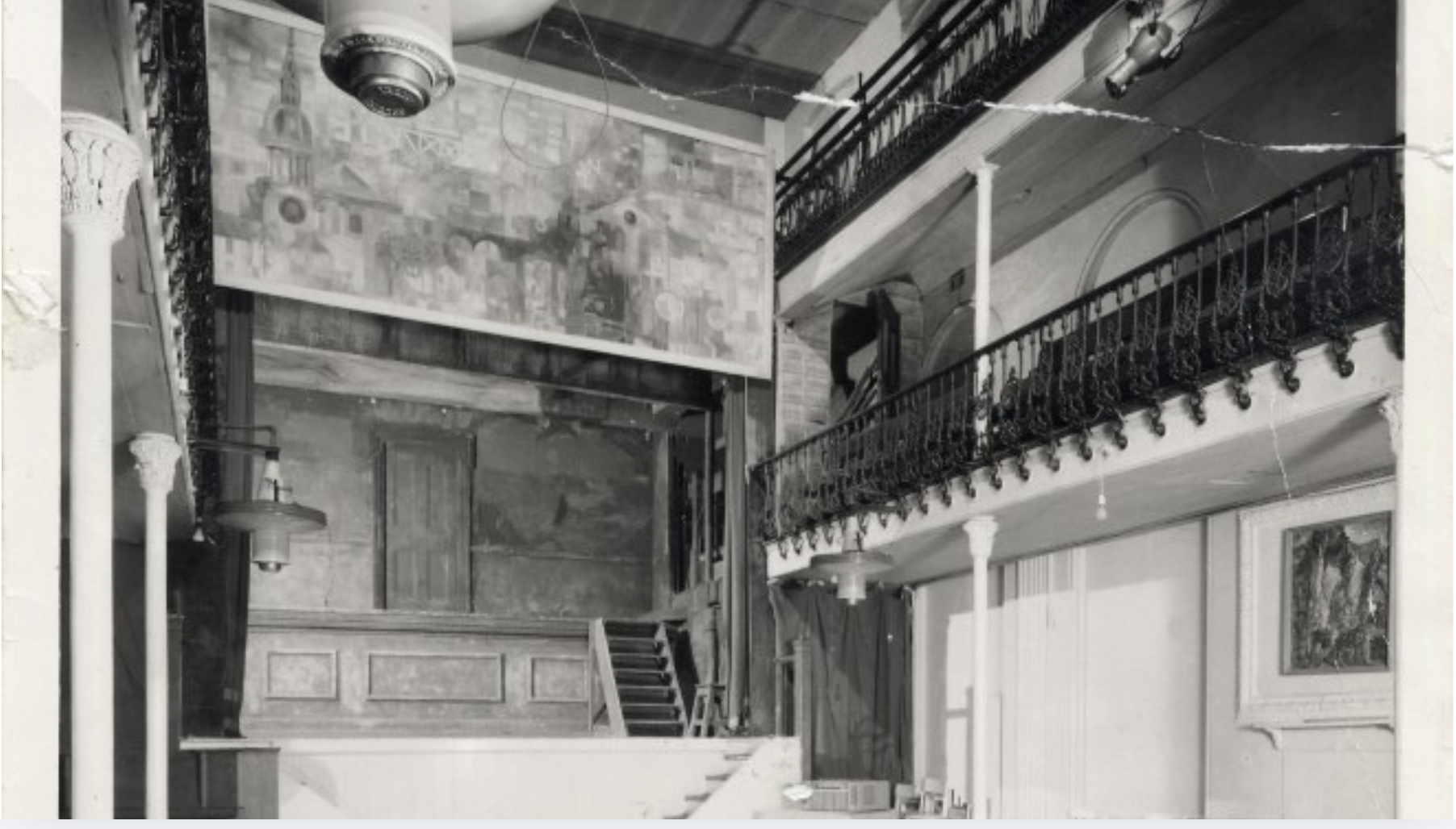 a black and white photo of the inside of a theatre