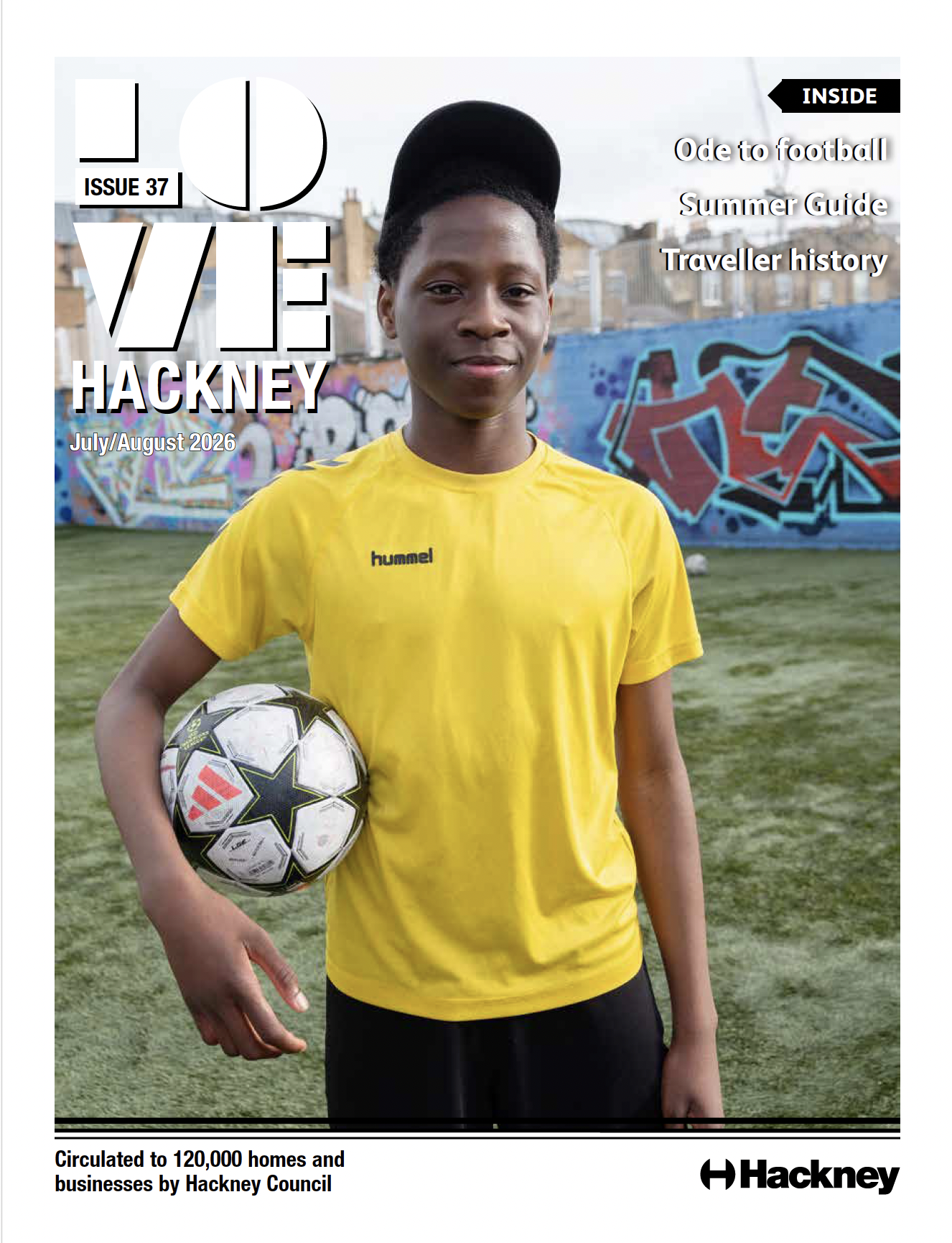 A boy in a yellow top holds a football