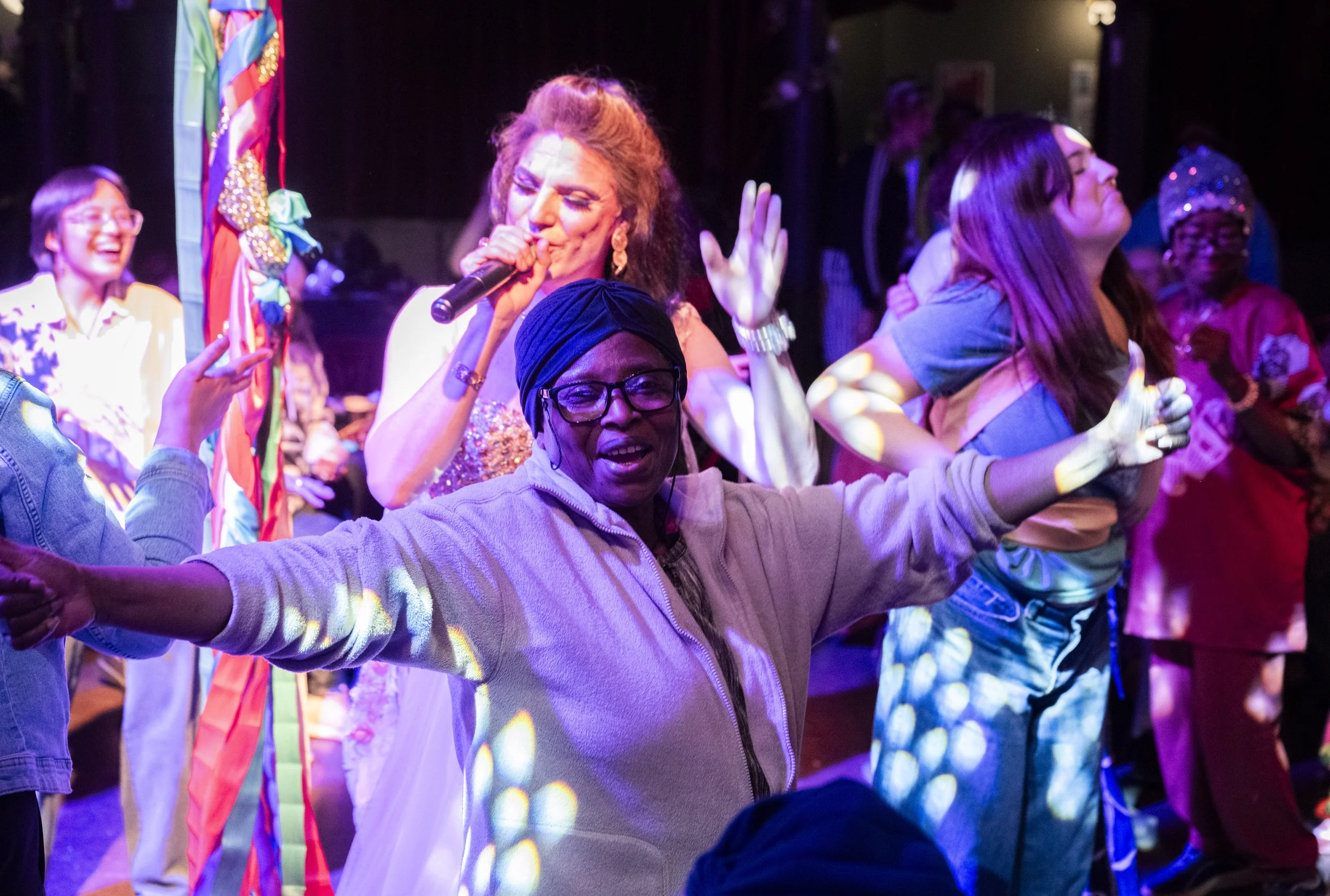 Older people are dancing at a joyous social event