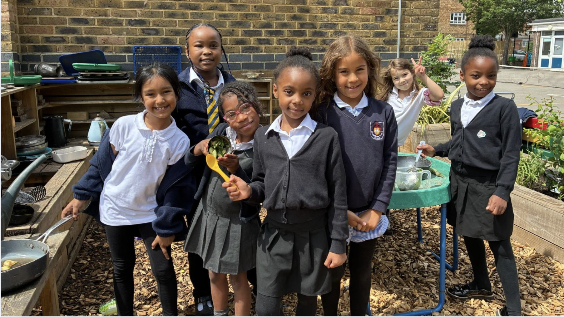 Primary aged students show off their new playground
