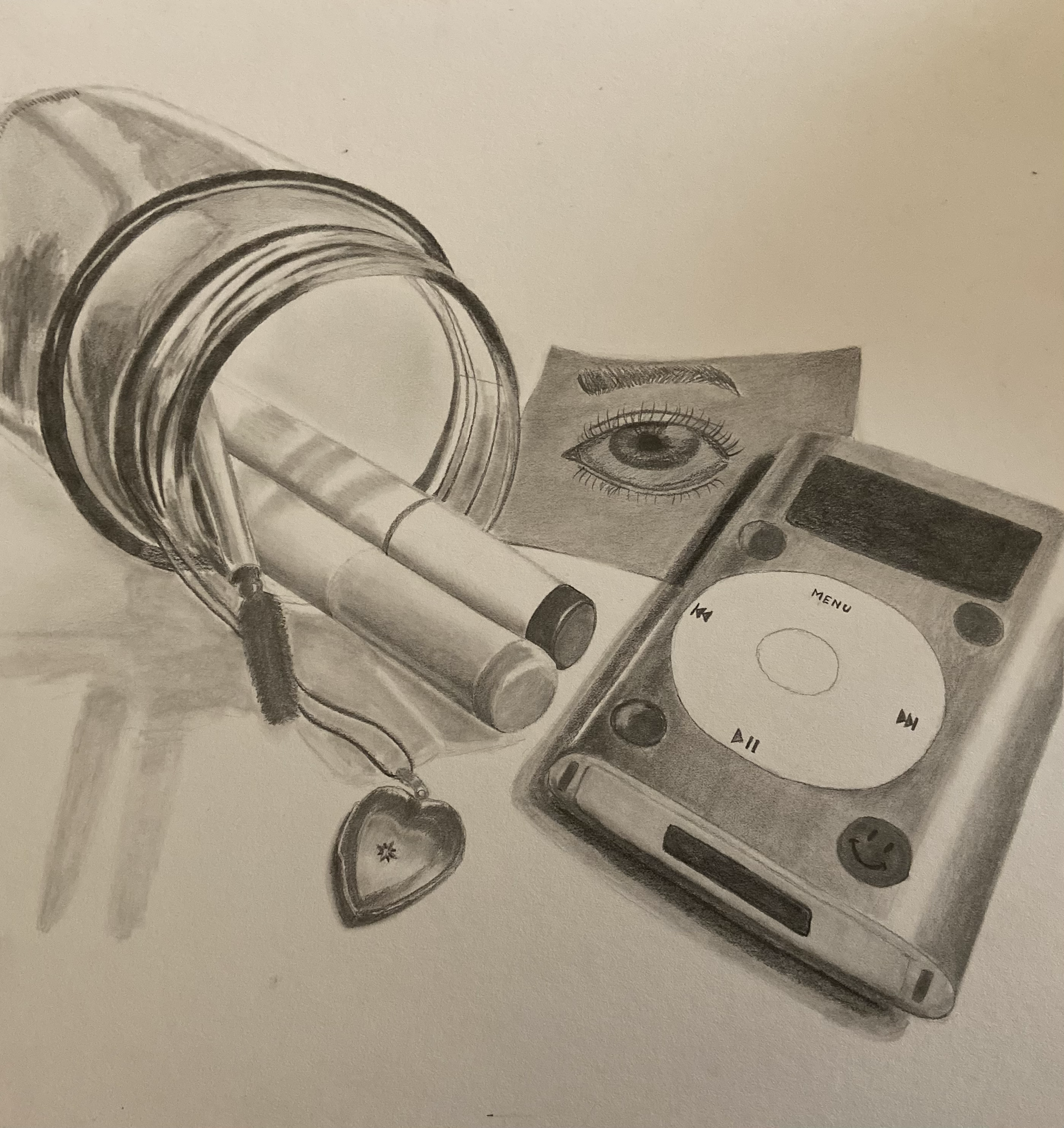 Personal Still Life - This was a piece I did in one of my drawing classes where we were to take a picture of things that we thought represented us and to draw them to the best of our ability using a gridding technique. I used sketching pencils for th