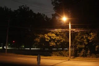 A landscape of a street light at night