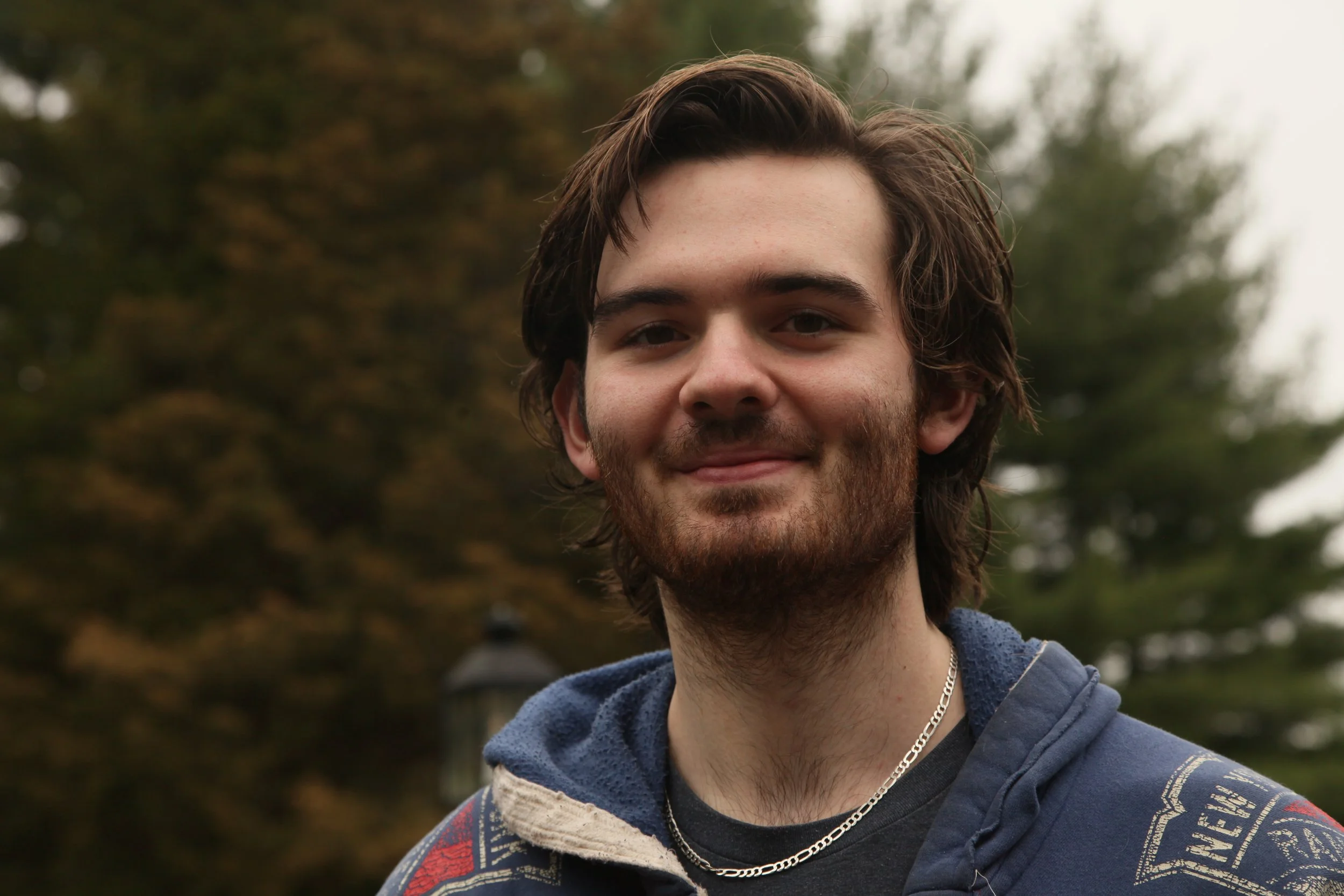 A headshot of a man outside