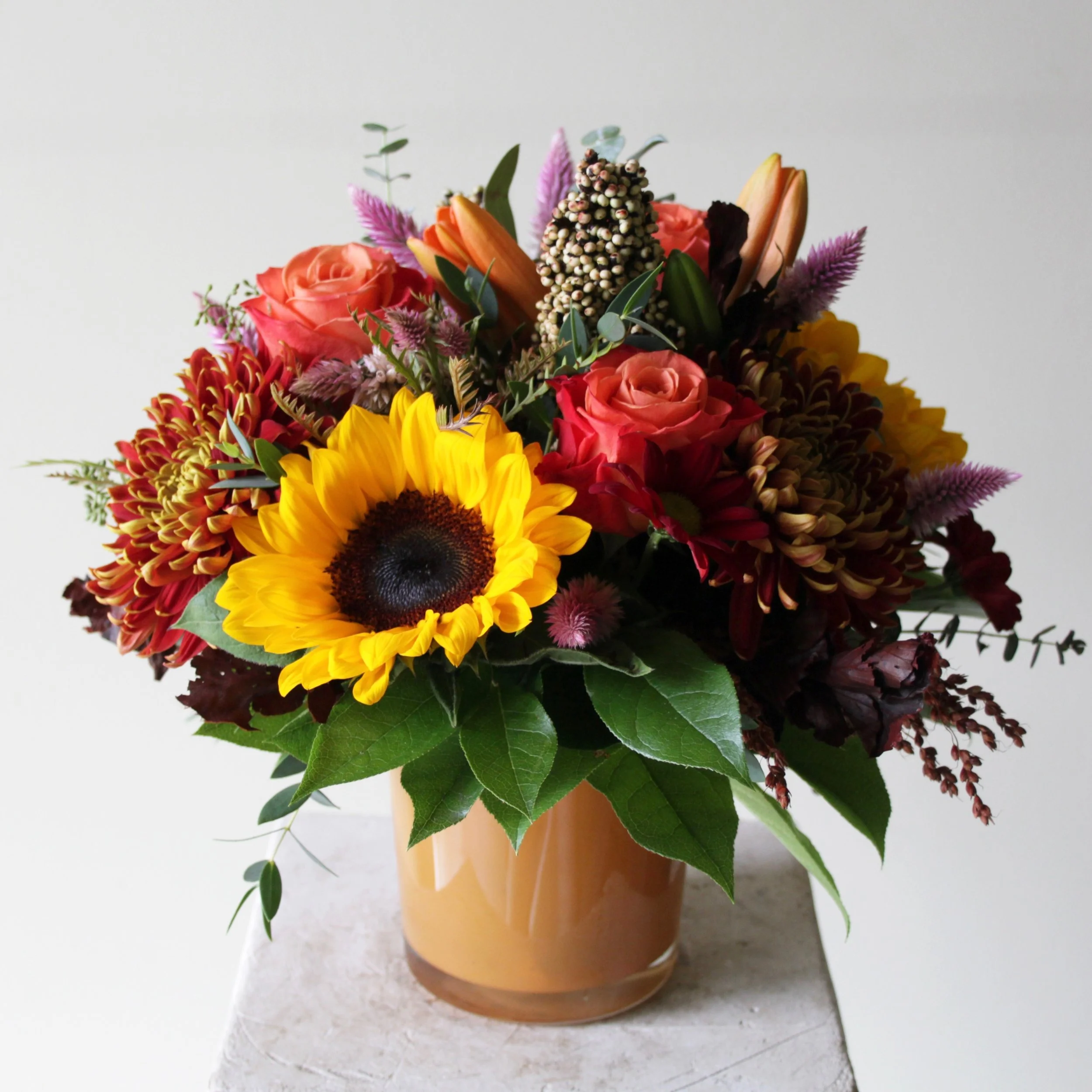 Image of a fall colored flower arrangement