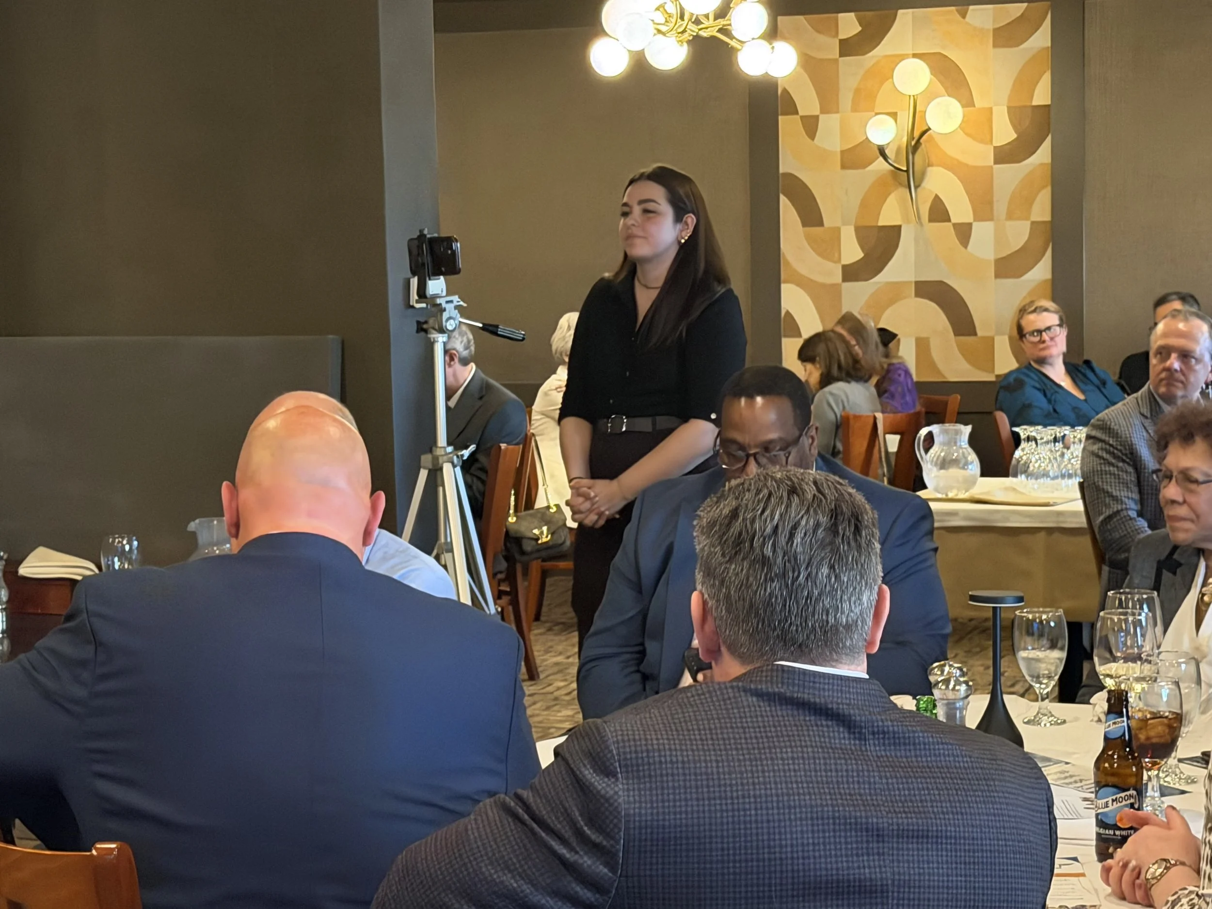 Sara Beyer recording speeches from an HCDC event