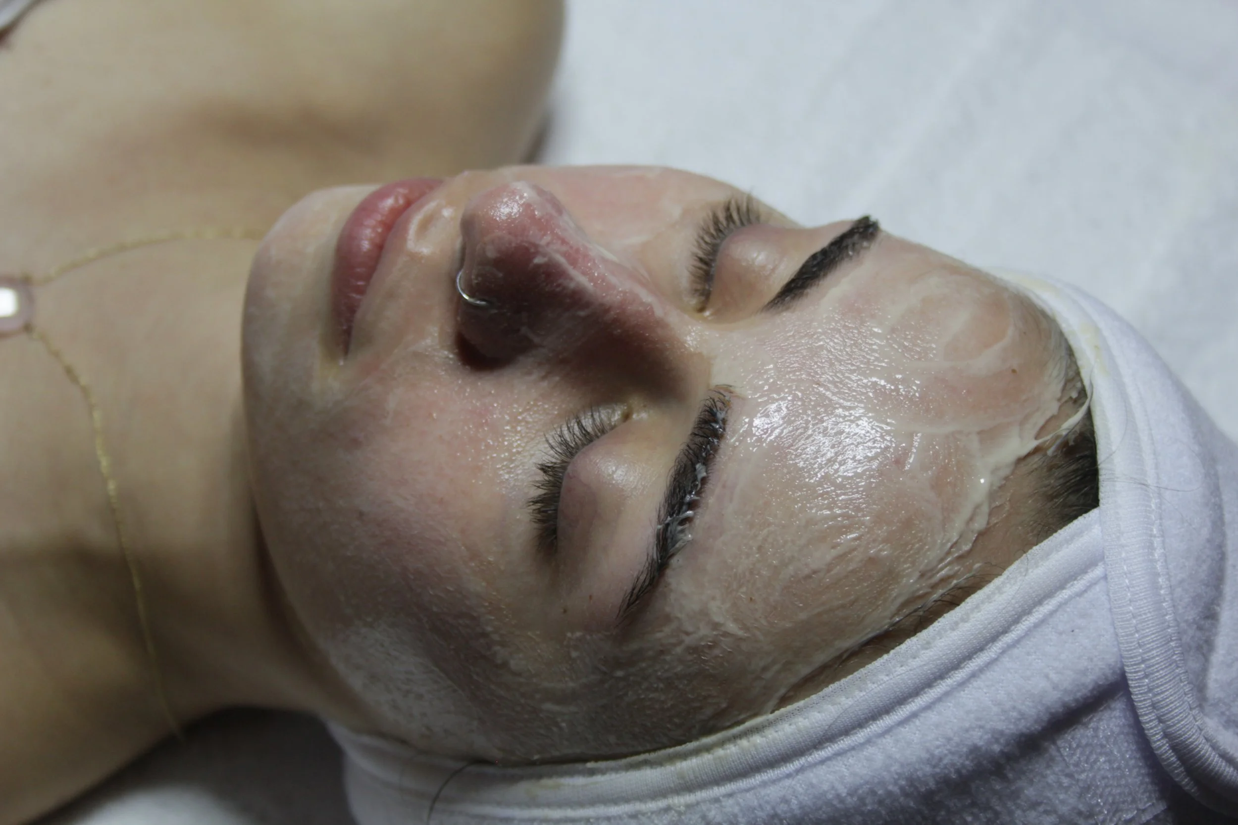 A person getting a facial done