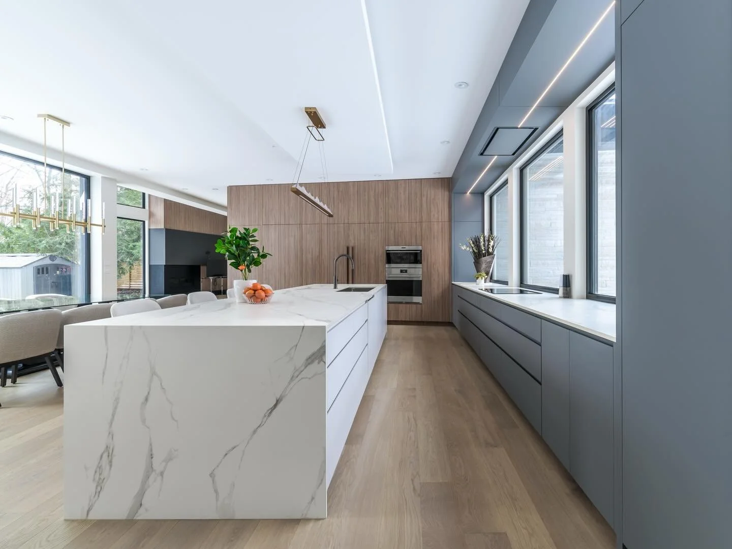 Clean lines. Thoughtful details. Built to last. ✨

From the seamless waterfall island to the warm wood tones and modern cabinetry, this kitchen reflects what luxury custom home building is all about&mdash;designing every detail around how you live. N