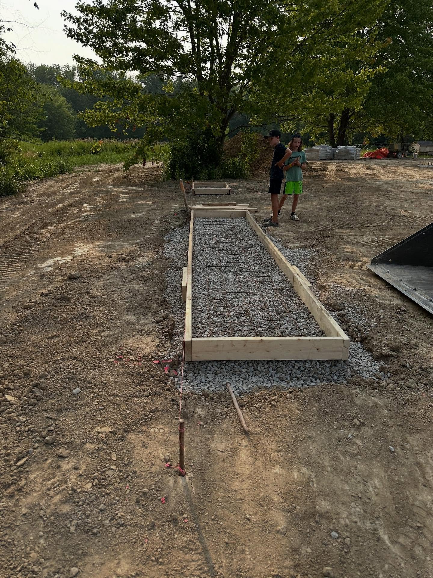 &ldquo;That form doesn&rsquo;t look straight Dad.. you&rsquo;d better fix it.&rdquo; These two have been raised around constant construction, and they sure have their Dad&rsquo;s eye for it.  #constructionkids #bornandraised #futurebuilders