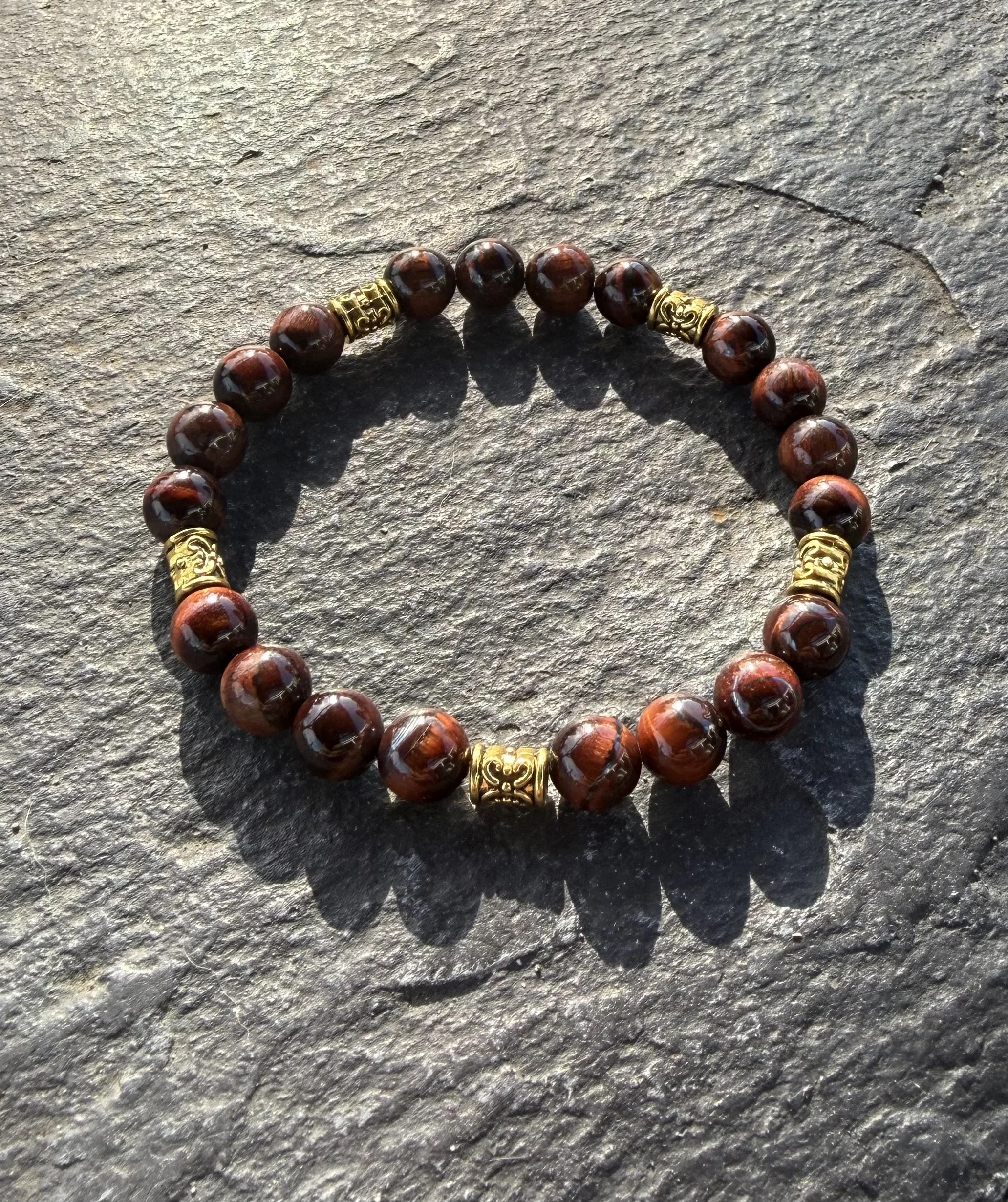 7" Red Tigers Eye Bracelet with Gold Tibetan Beads