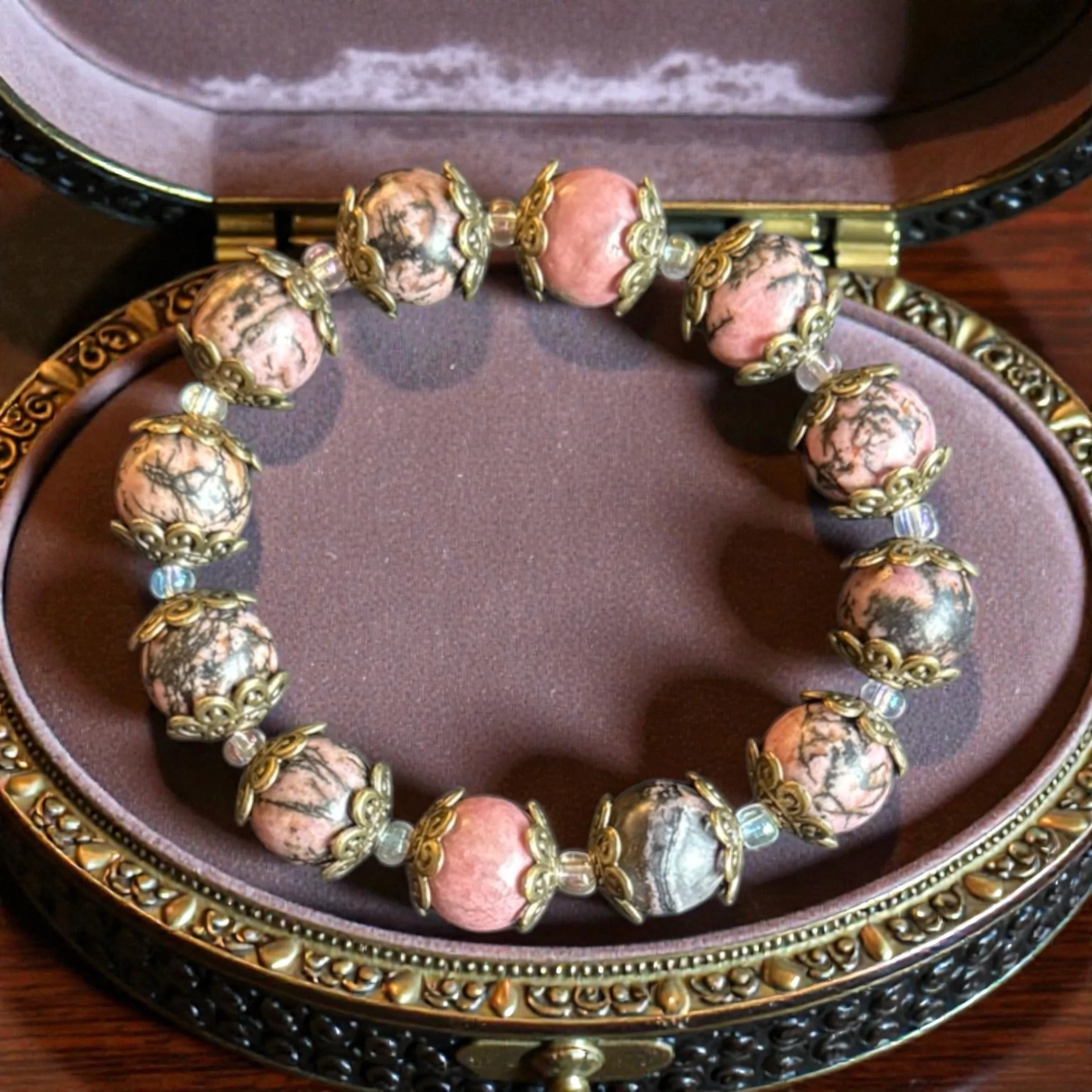 Elegant 7" Rhodonite Bracelet with Vintage Bronze Accents