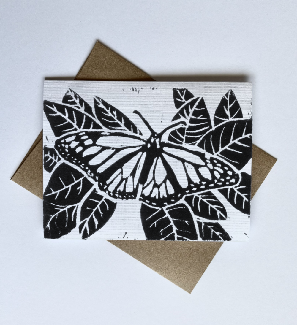 Black and white monarch butterfly illustration printed on a greeting card