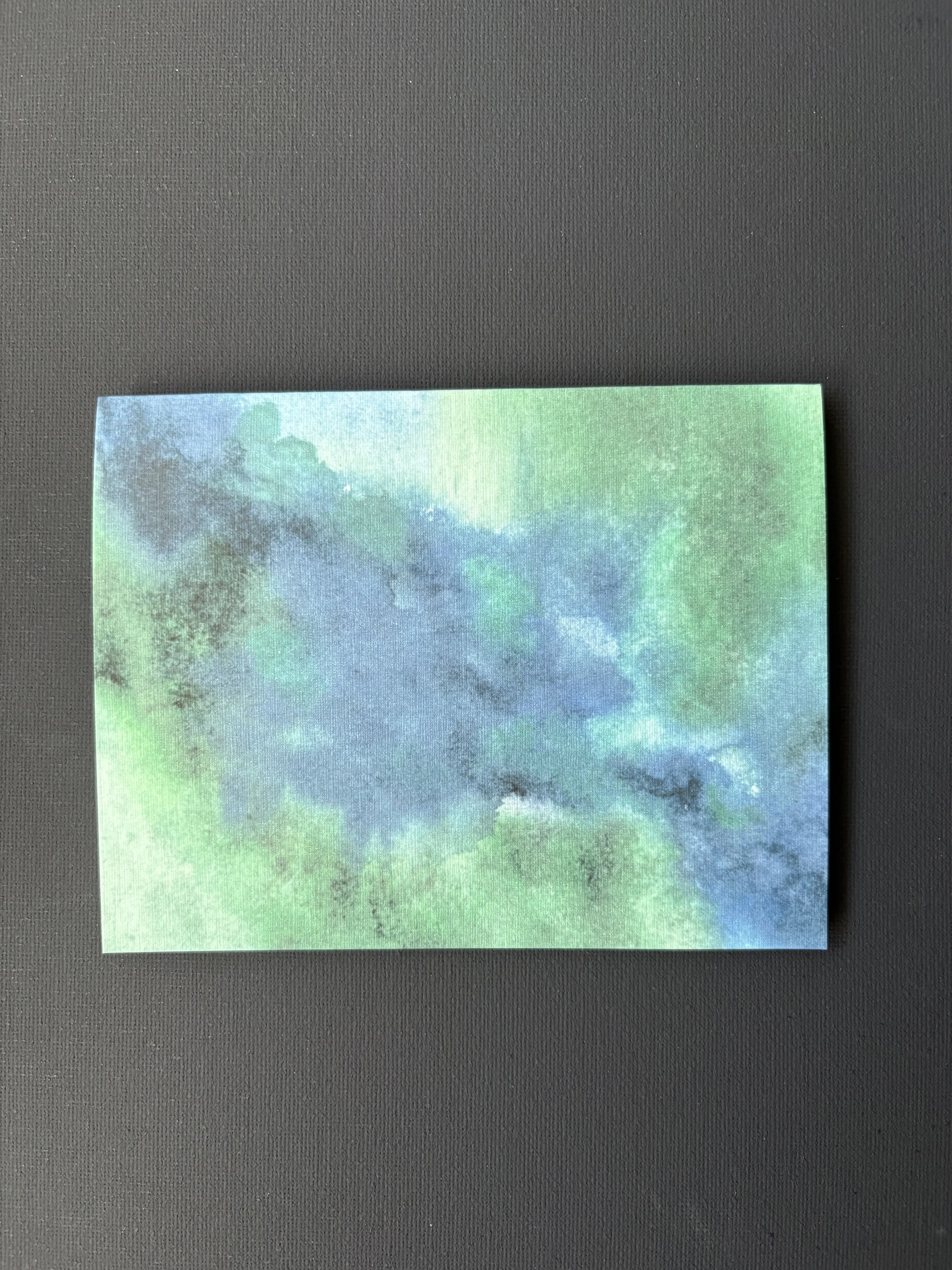“Green Pastures, Still Waters” abstract watercolor card inspired by Psalm 23:2, with deep green and blue tones evoking peace, rest, and God’s presence.
