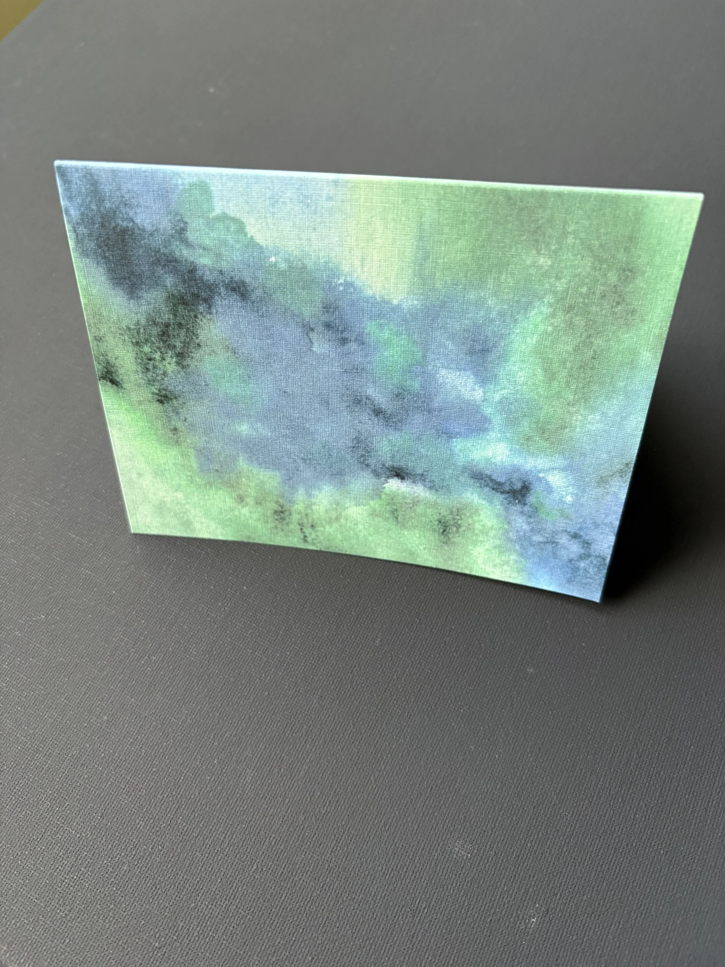 “Green Pastures, Still Waters” abstract watercolor card inspired by Psalm 23:2, with deep green and blue tones evoking peace, rest, and God’s presence.