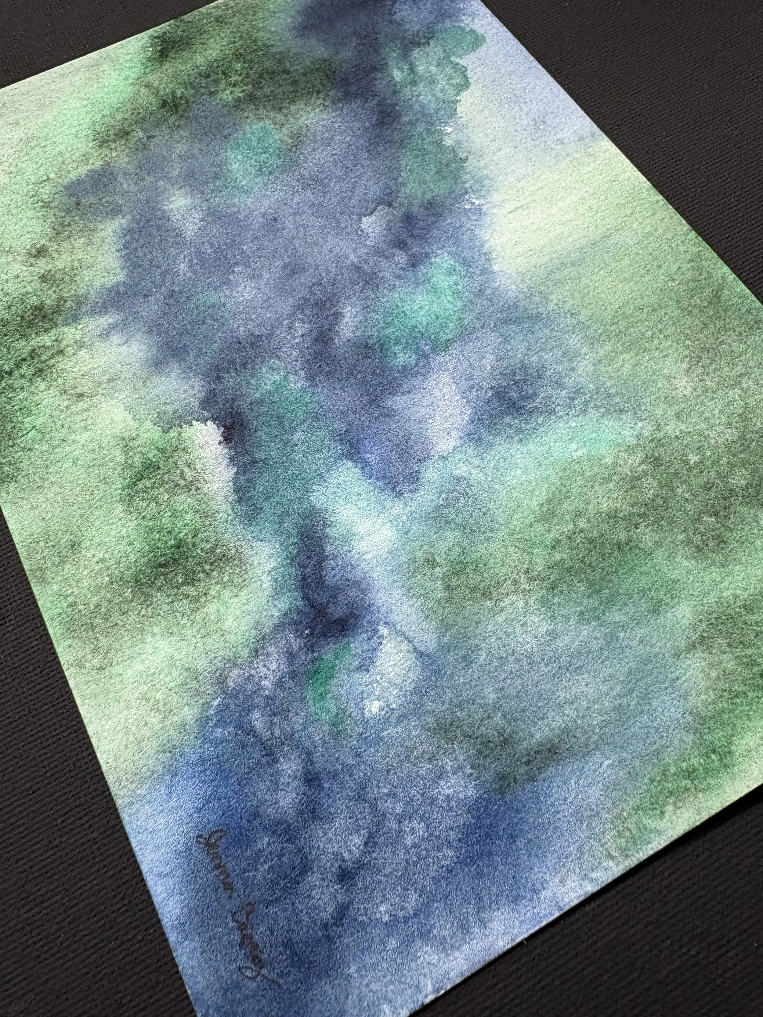 Abstract watercolor “Green Pastures, Still Waters” inspired by Psalm 23:2, with deep green and blue tones evoking peace, rest, and God’s presence.