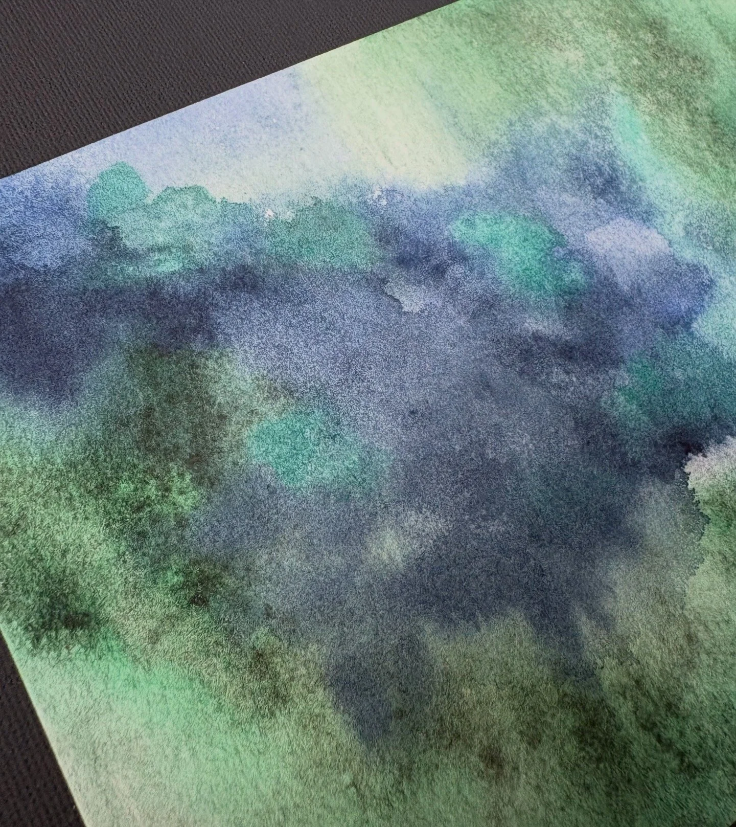 Abstract watercolor “Green Pastures, Still Waters” inspired by Psalm 23:2, with deep green and blue tones evoking peace, rest, and God’s presence.