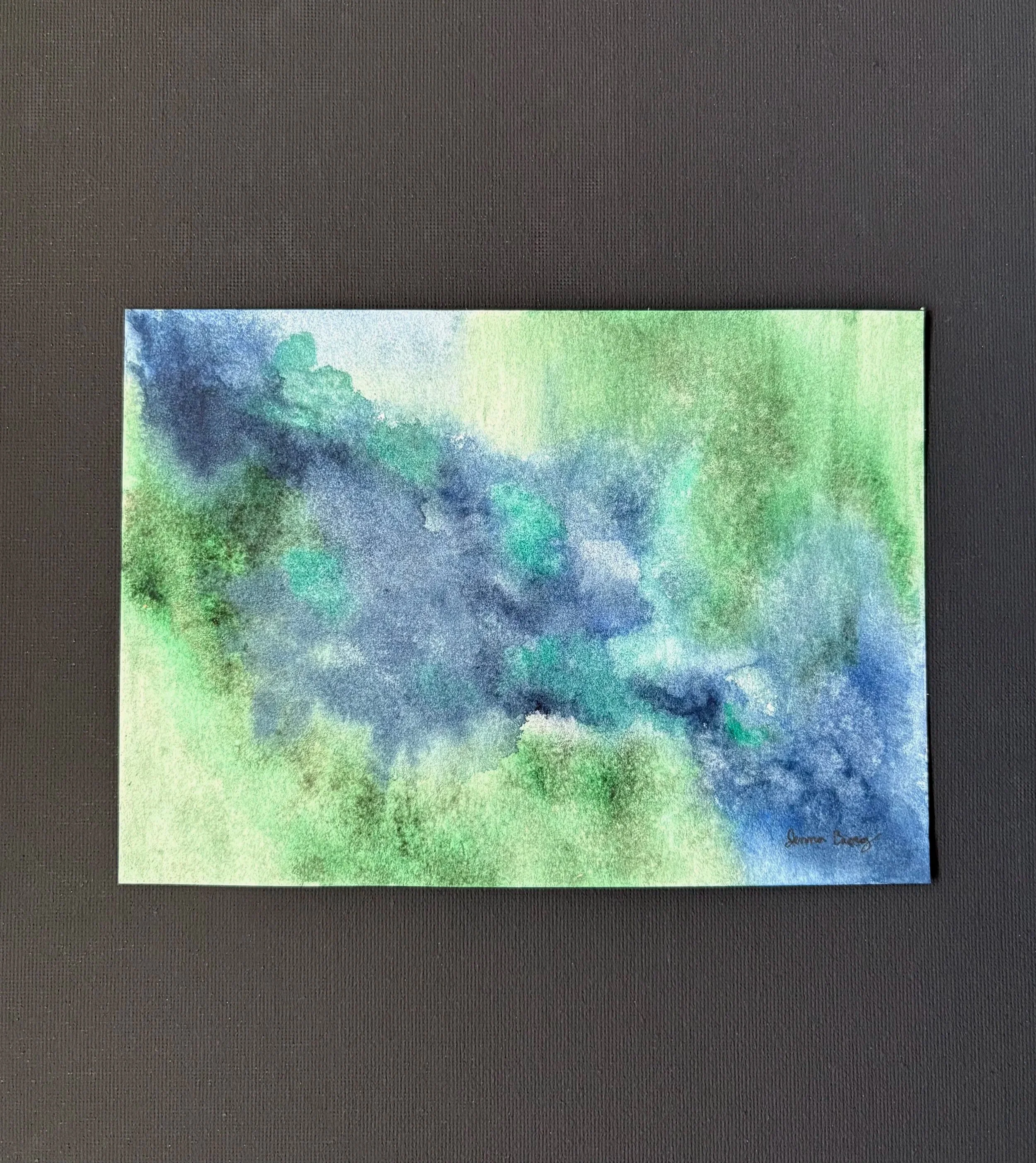 Abstract watercolor “Green Pastures, Still Waters” inspired by Psalm 23:2, with deep green and blue tones evoking peace, rest, and God’s presence.