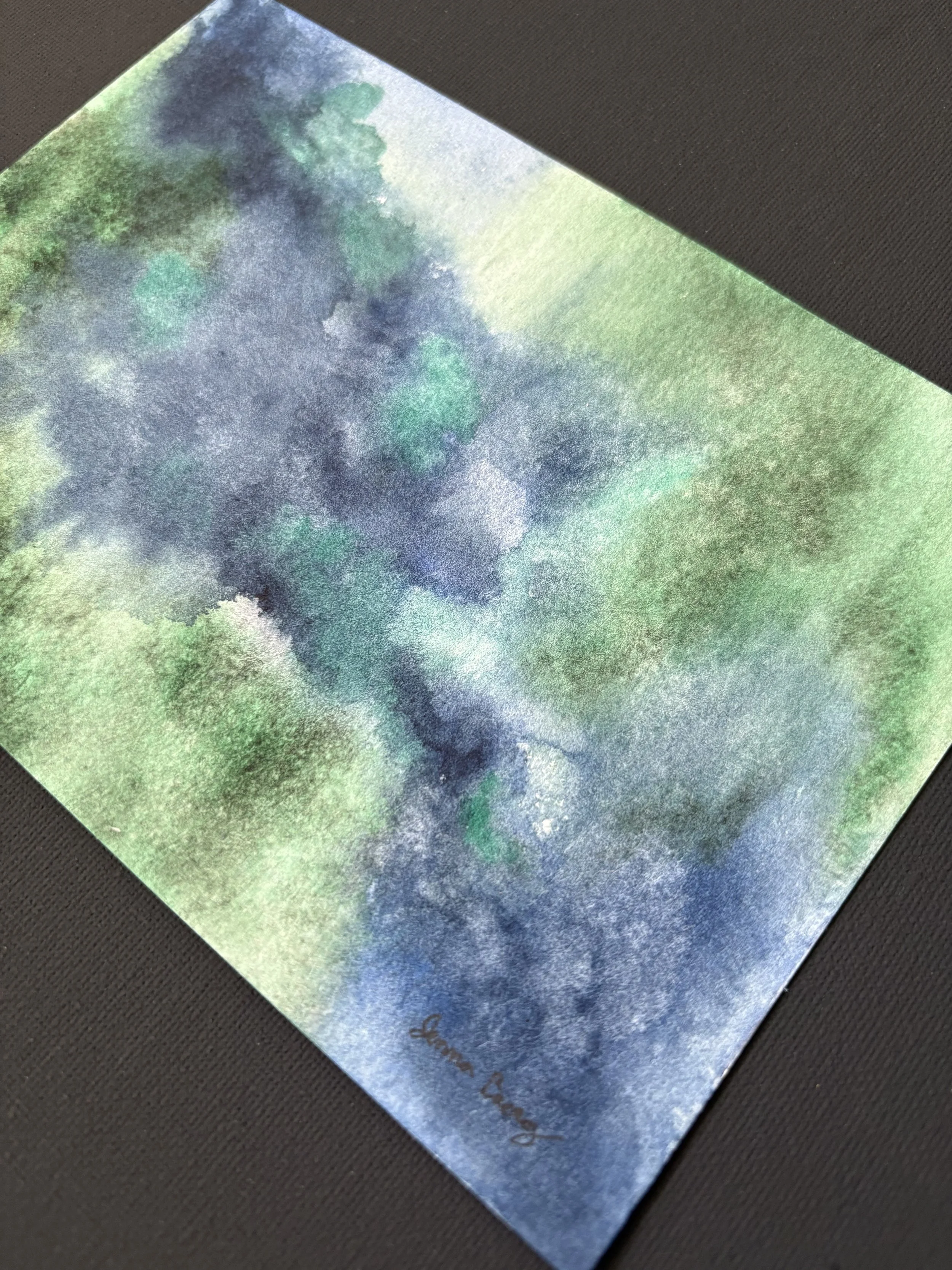 Abstract watercolor “Green Pastures, Still Waters” inspired by Psalm 23:2, with deep green and blue tones evoking peace, rest, and God’s presence.