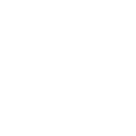 A white cloud floating in a bright blue sky.