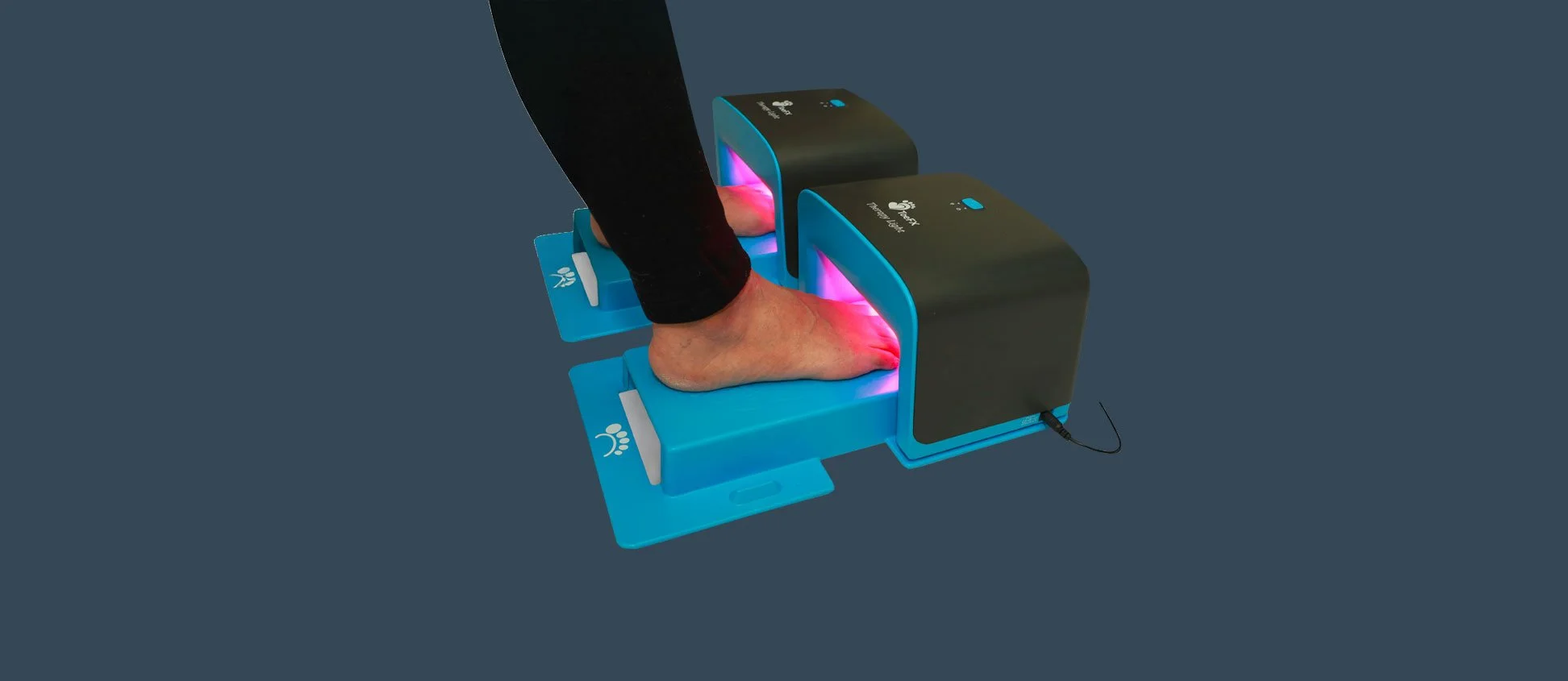 A person standing on a blue foot scanner with infrared lights, displaying their foot and heel for analysis.