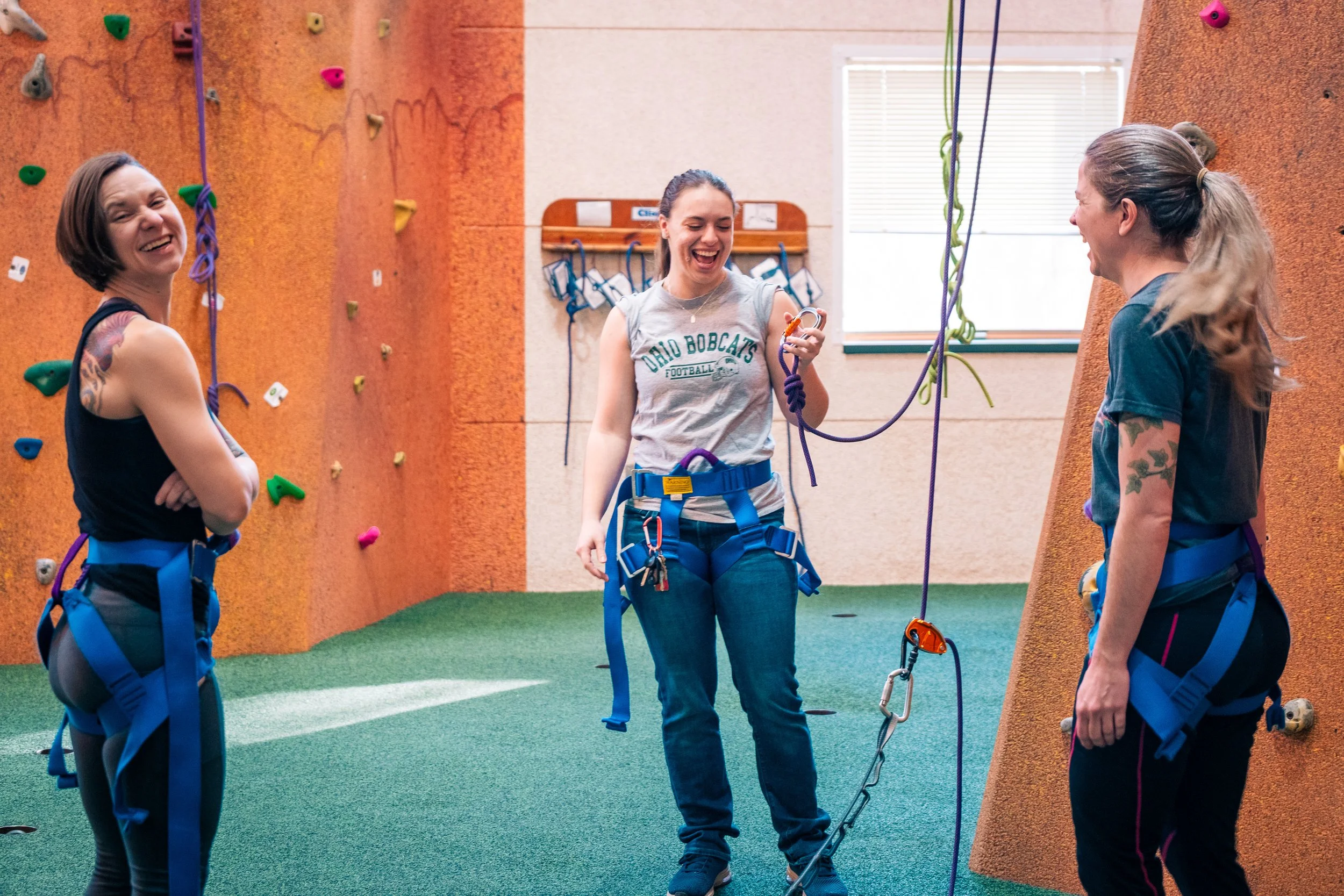 rock climbing at queer summer camp for adults
