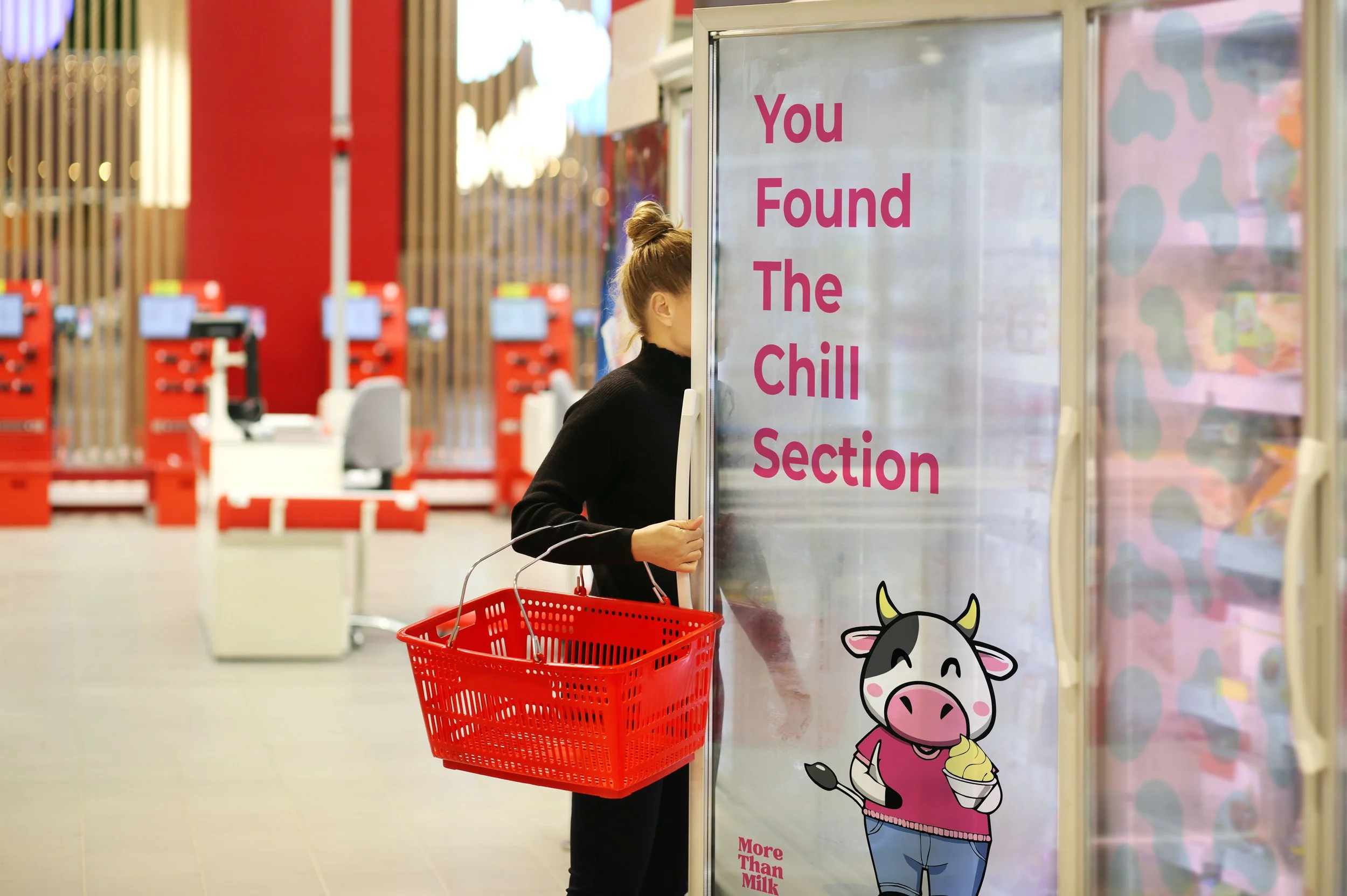 shopper-in-supermarket-with-basket-by-refrigerator-2026-09-25-02-48-49-utc.jpg