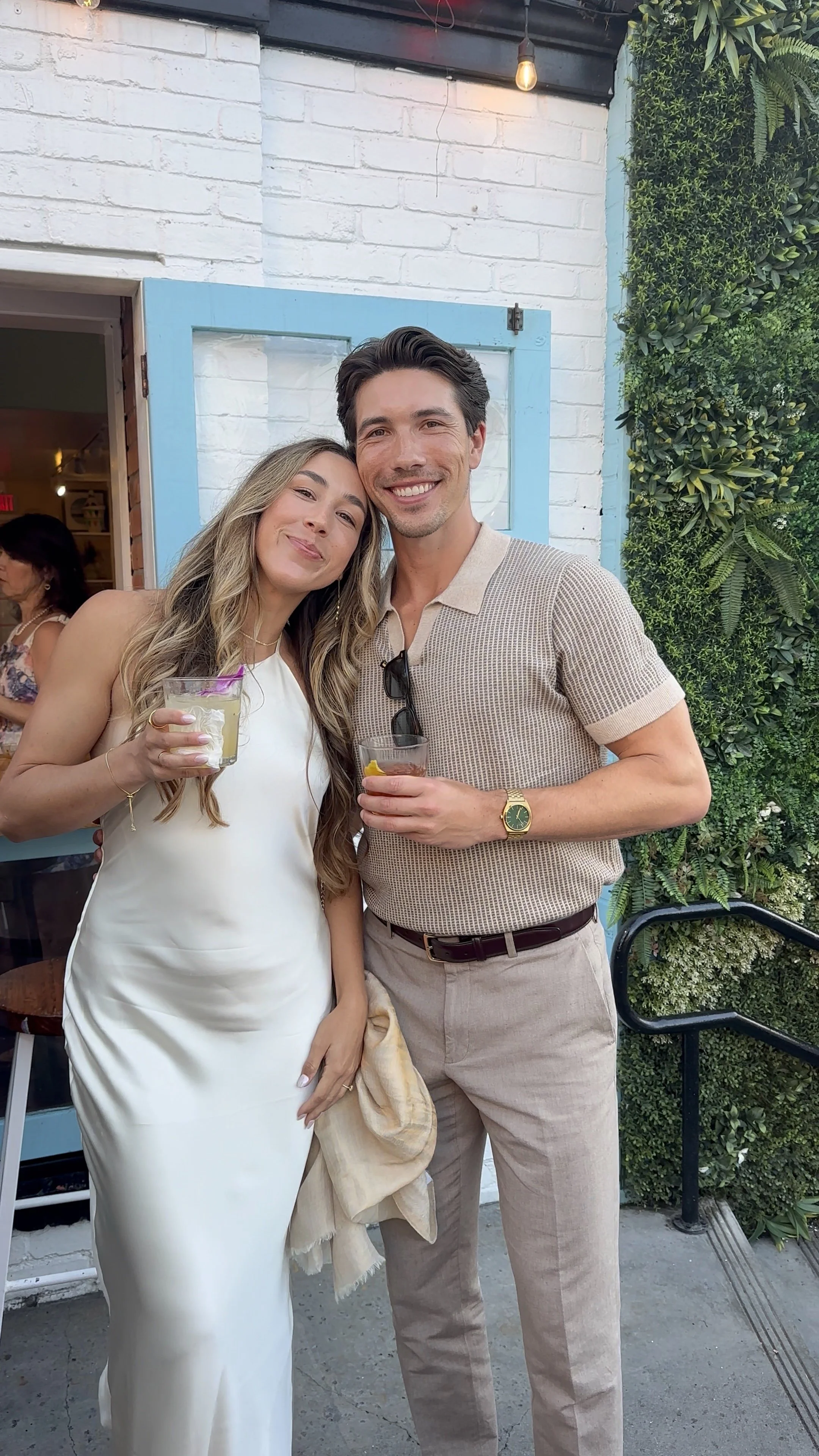 a couple at their welcome drinks on their wedding weekend in san diego california by wilmington content co - content creator in north carolina