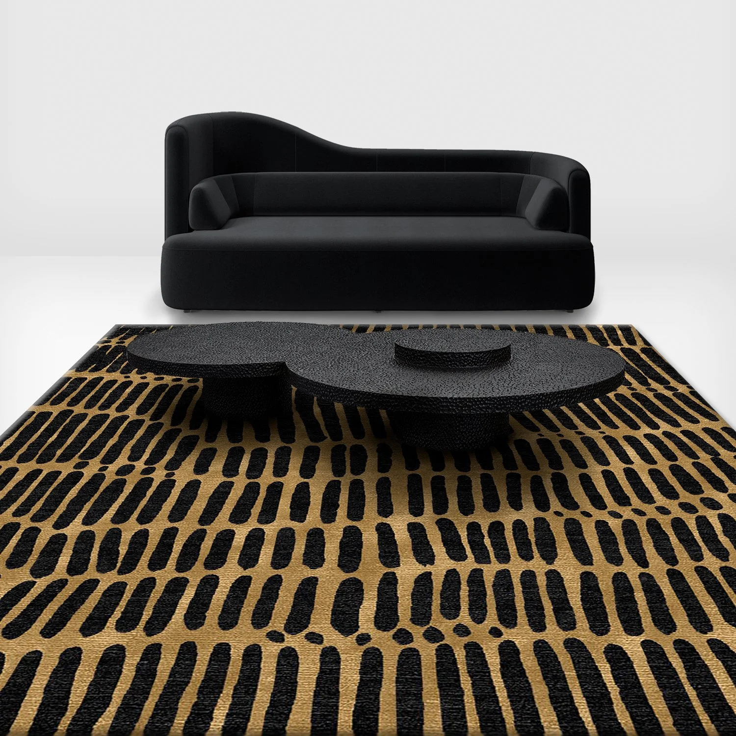 A modern black sofa and a black textured coffee table on a patterned black and brown rug against a white background.