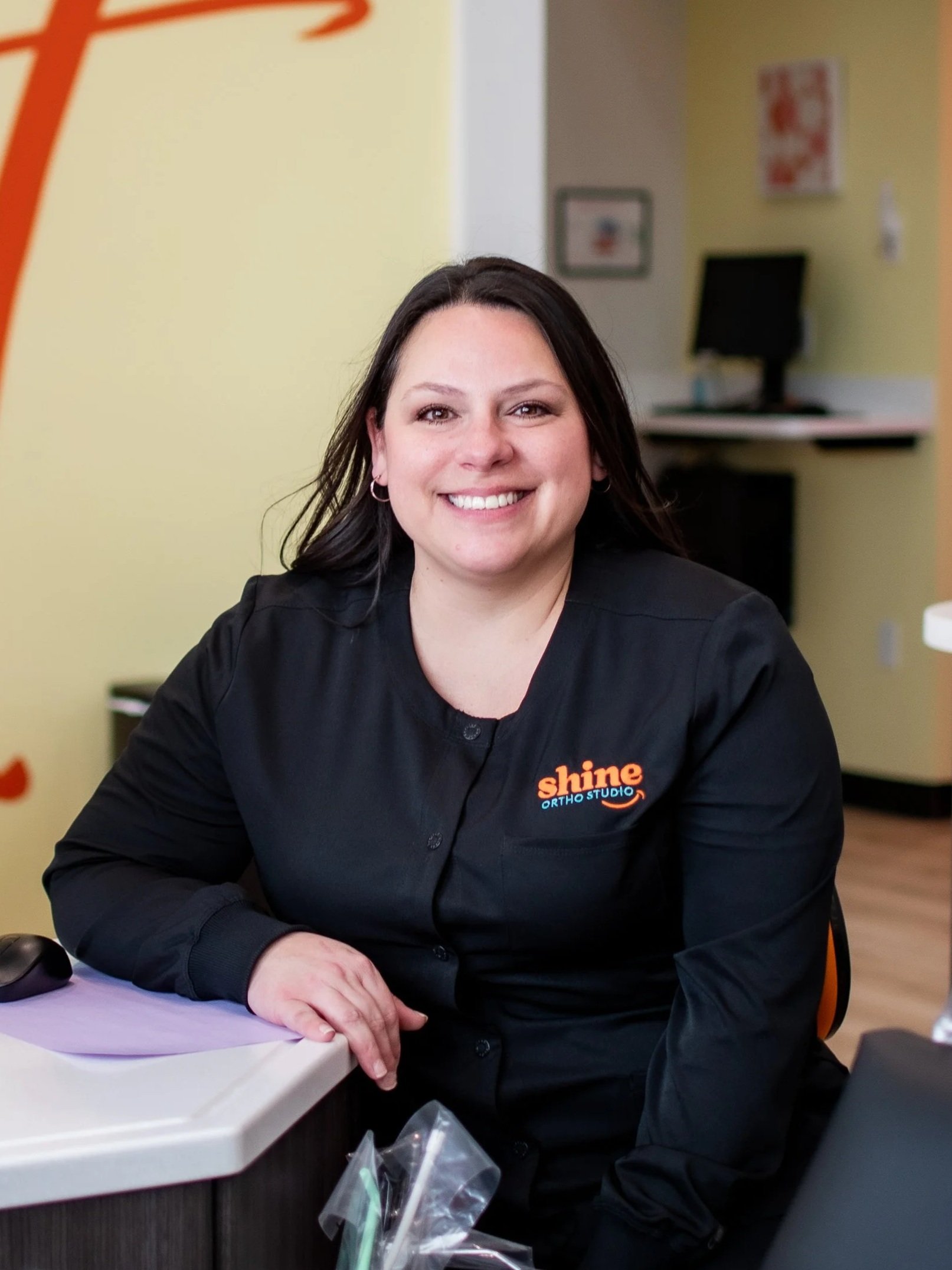 Vanessa Gonzales, orthodontic dental assistant at Shine Ortho Studio, smiling in the clinical space