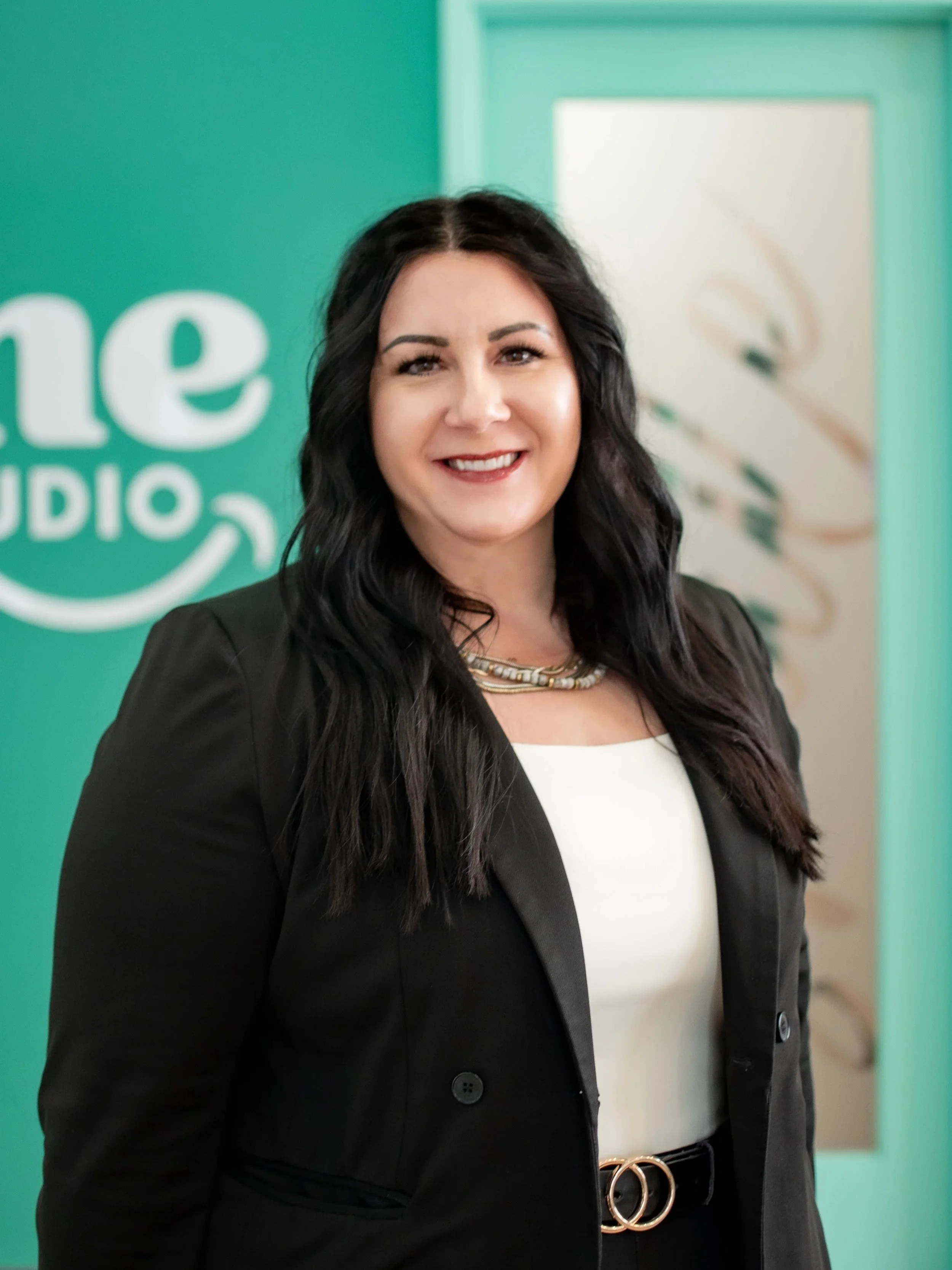 Ashley Dugan, practice administrator at Shine Ortho Studio, standing in the office