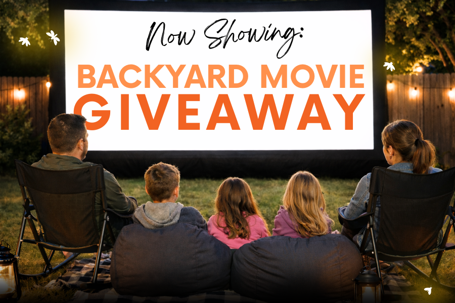 Family sitting outdoors watching a backyard movie screen promoting a Shine Ortho Studio giveaway for a summer movie night experience.
