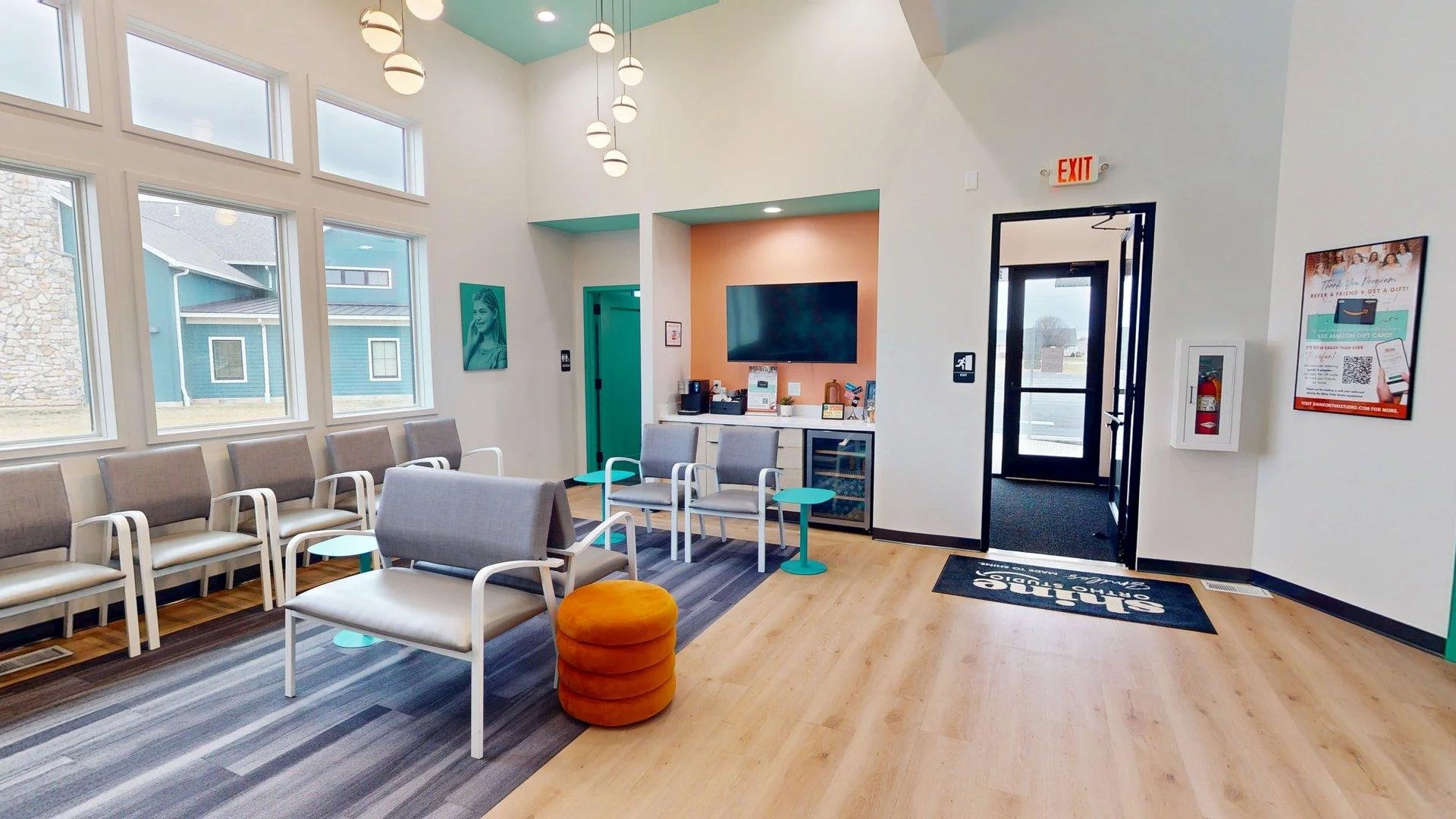 Modern waiting room interior at Shine Ortho Studio featuring a bright, welcoming space with seating, front desk, and contemporary design.