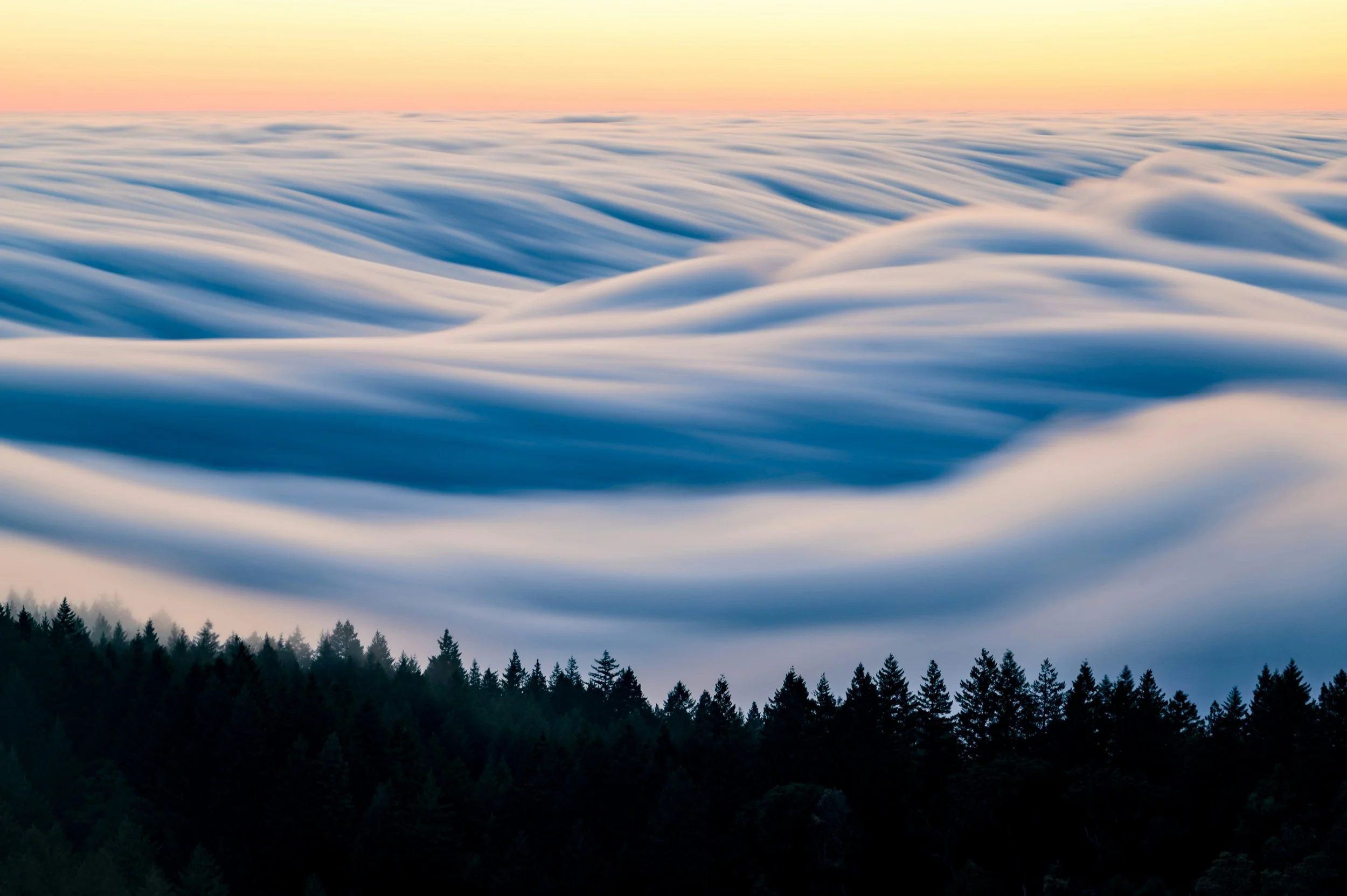 Blue sky with waves of clouds signifying virtual therapy services in BC 