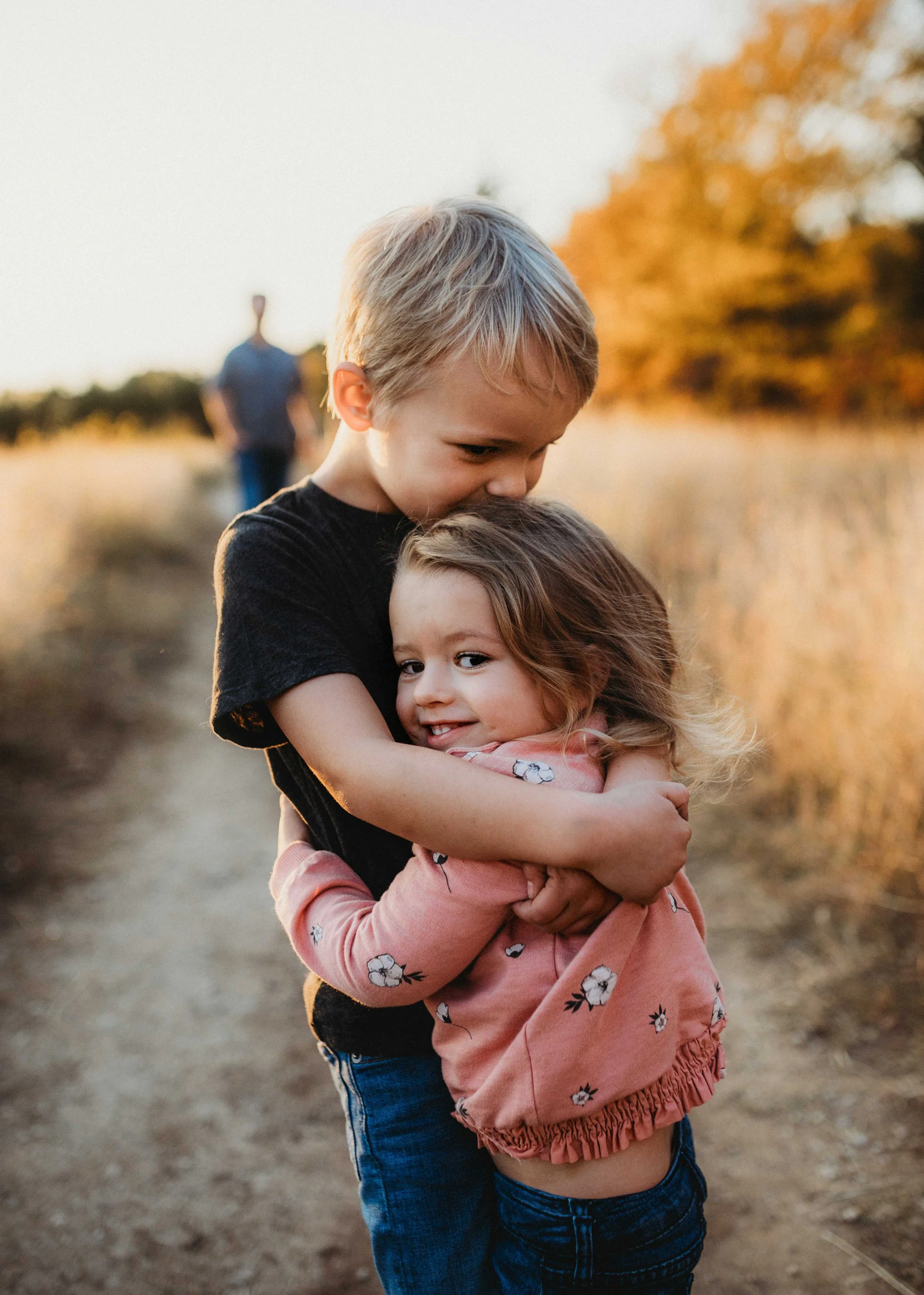 Children hugging in sunset after Virtual Counselling in BC