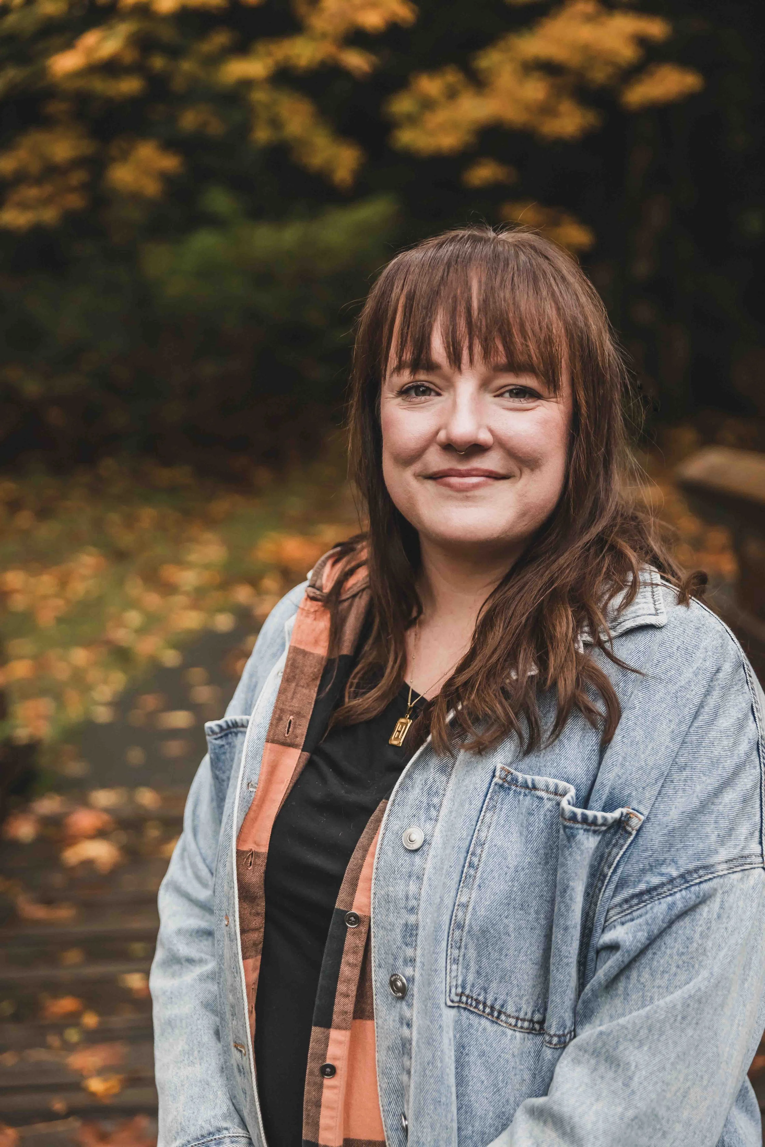 Counsellor Rebeka Allen RCC smiling warmly in nature