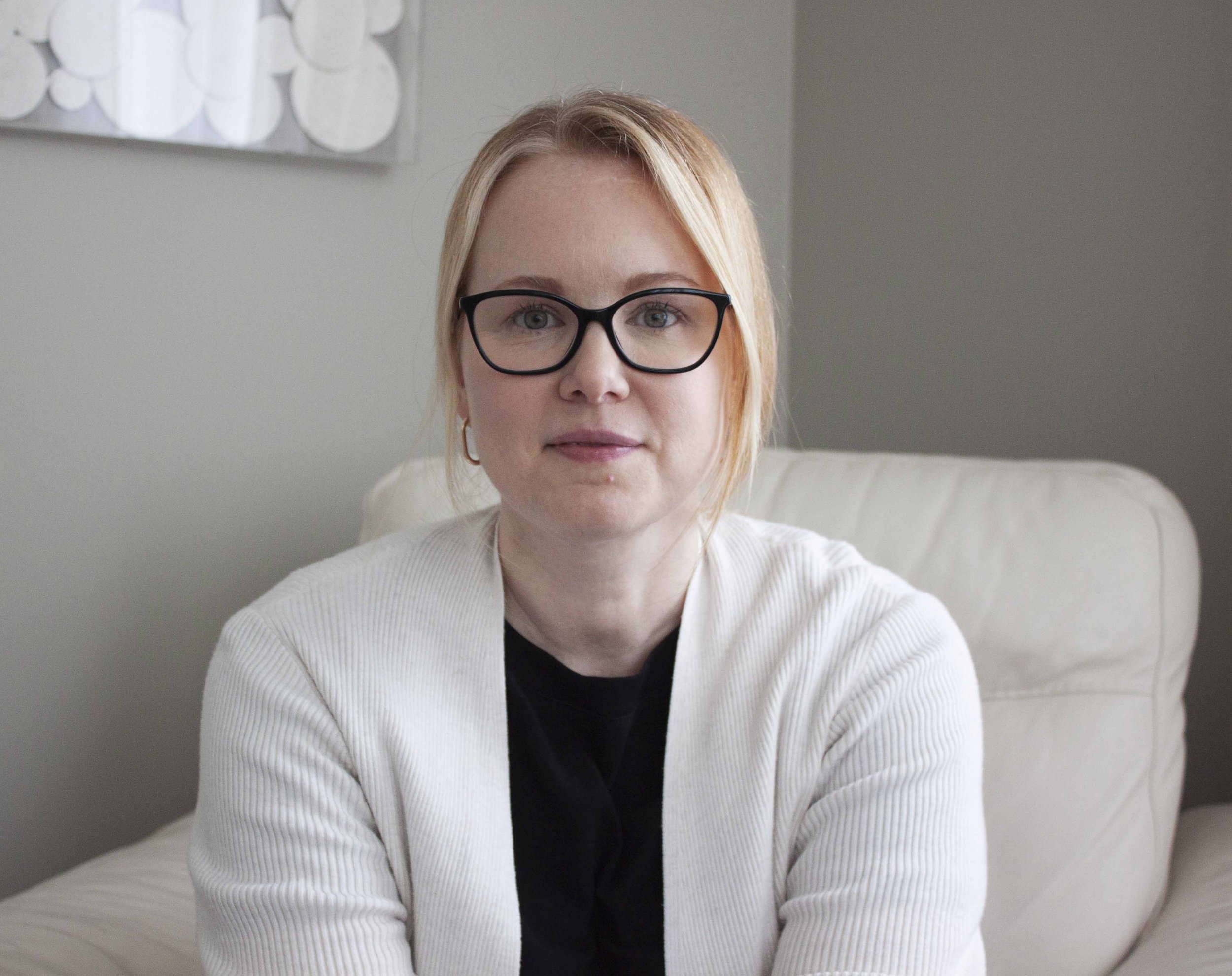 Therapist Julie Thomason, RCC-ACS sitting in the counselling office.