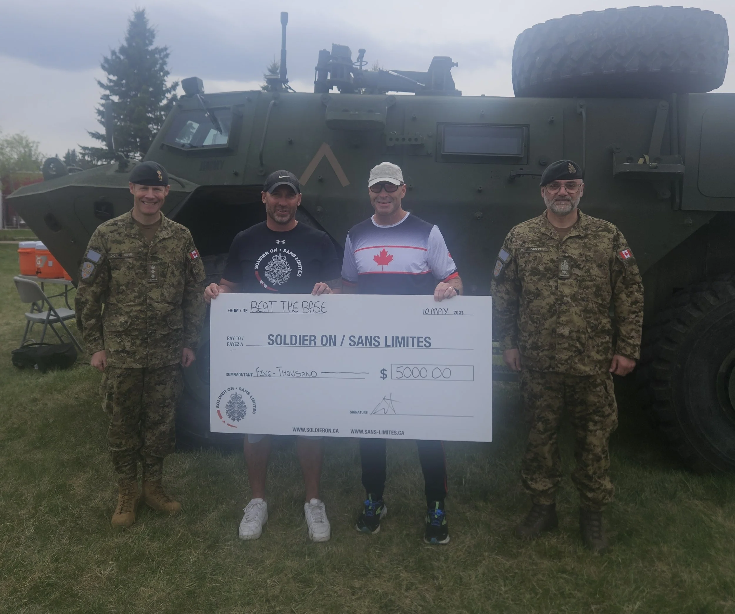 MGen Molstad, the CAF Triathlon Patron, presenting the $5,000 donation to Soldier-On on behalf of Beat-the-Base and GETT.