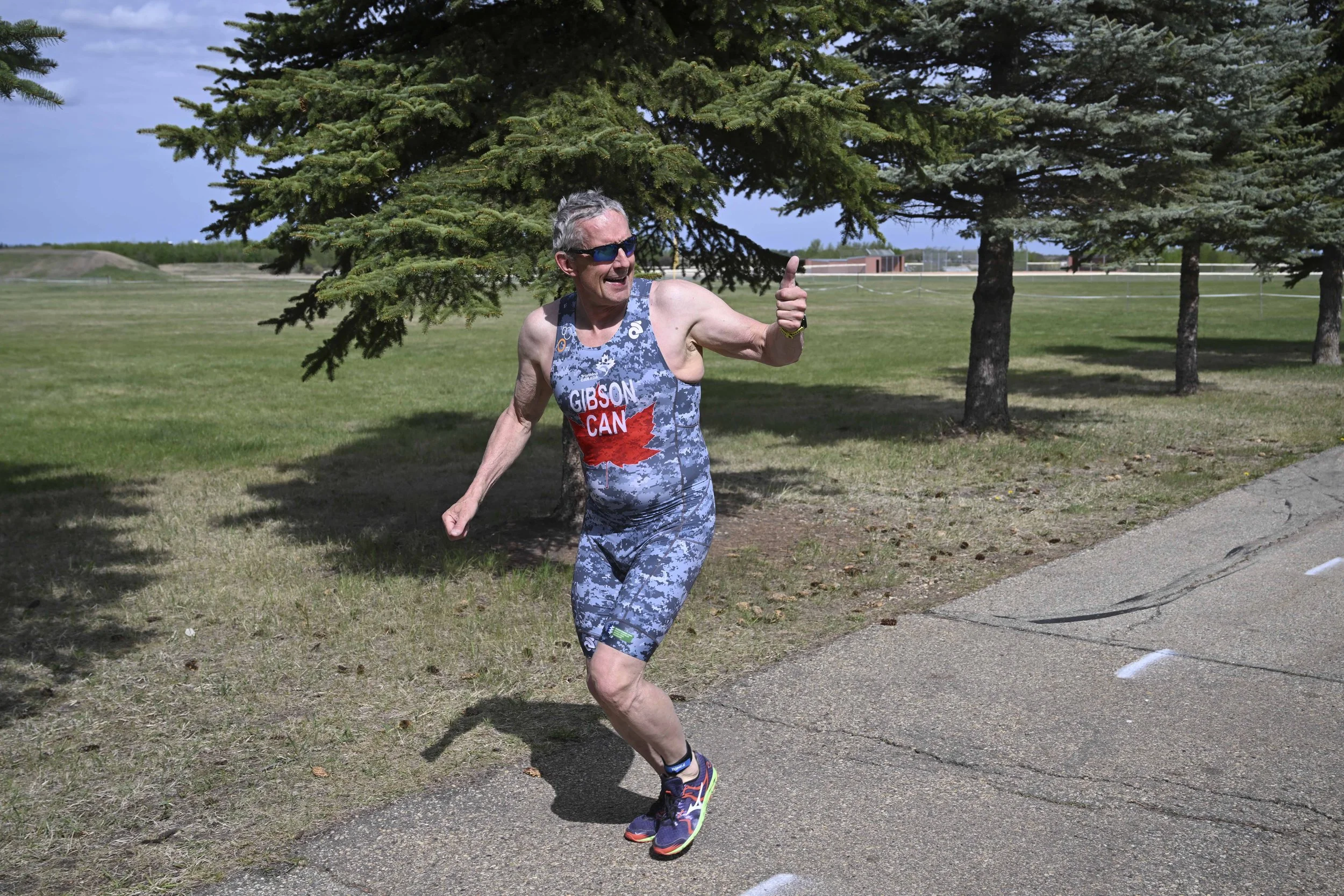 The Assistant Race Director enjoying the weather the the leg burn at the start of the run course in 2025.