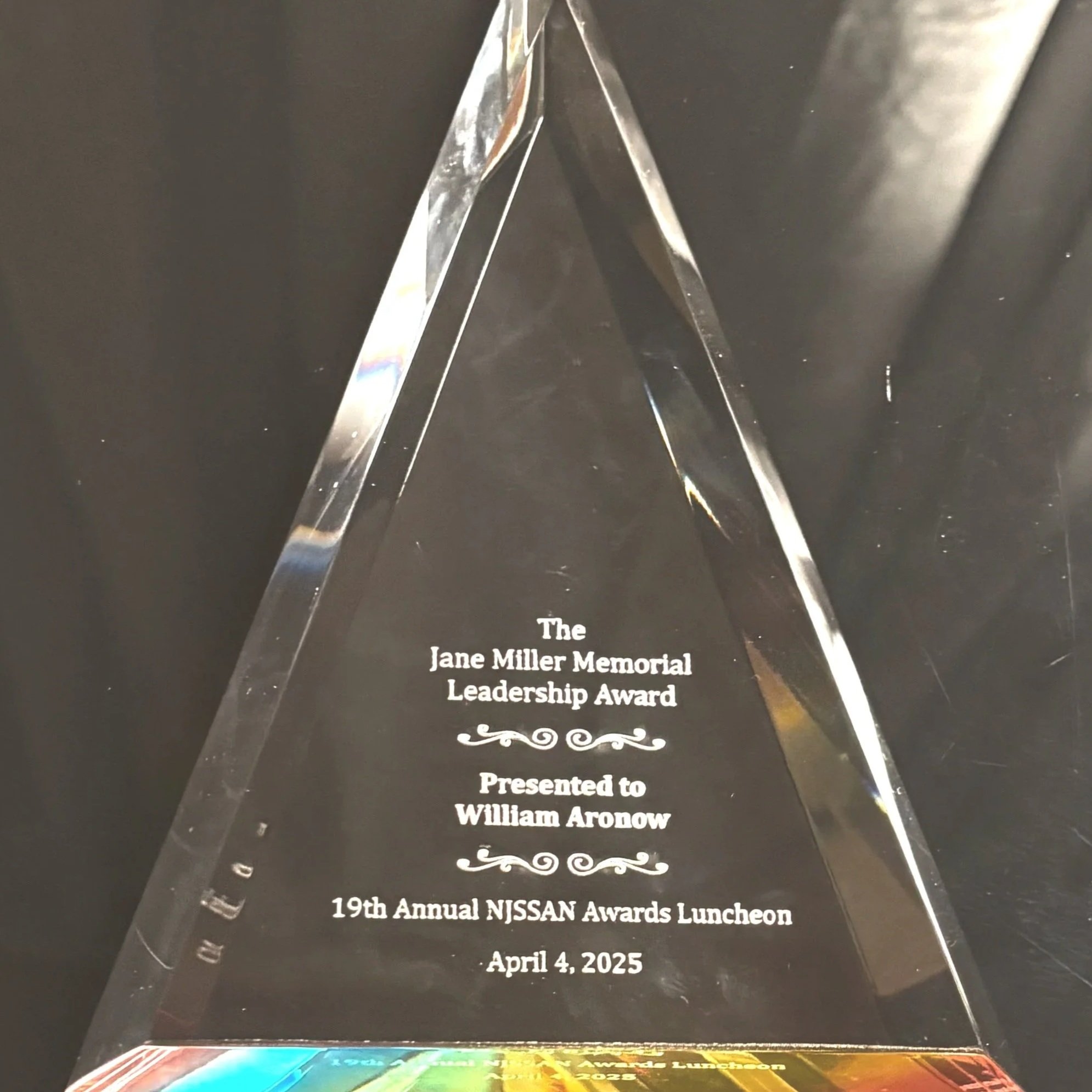 Upright acrylic prism inscribed: "The Jane Miller Memorial Leadership Award, presented to, William Aronow, at the NJSSAN Awards Luncheon" for self-advocate by The Arc of NJn, April 4, 2025