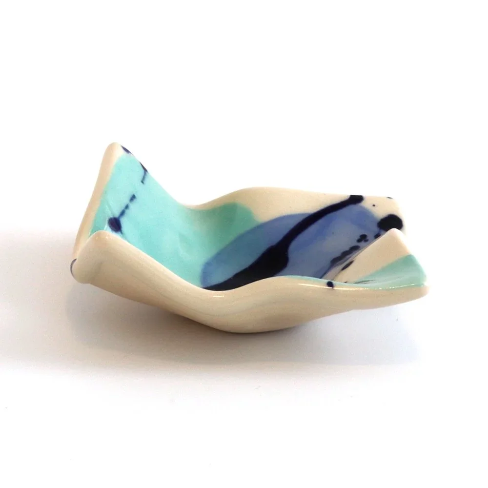 wavy ceramic dish in blues and cream colors