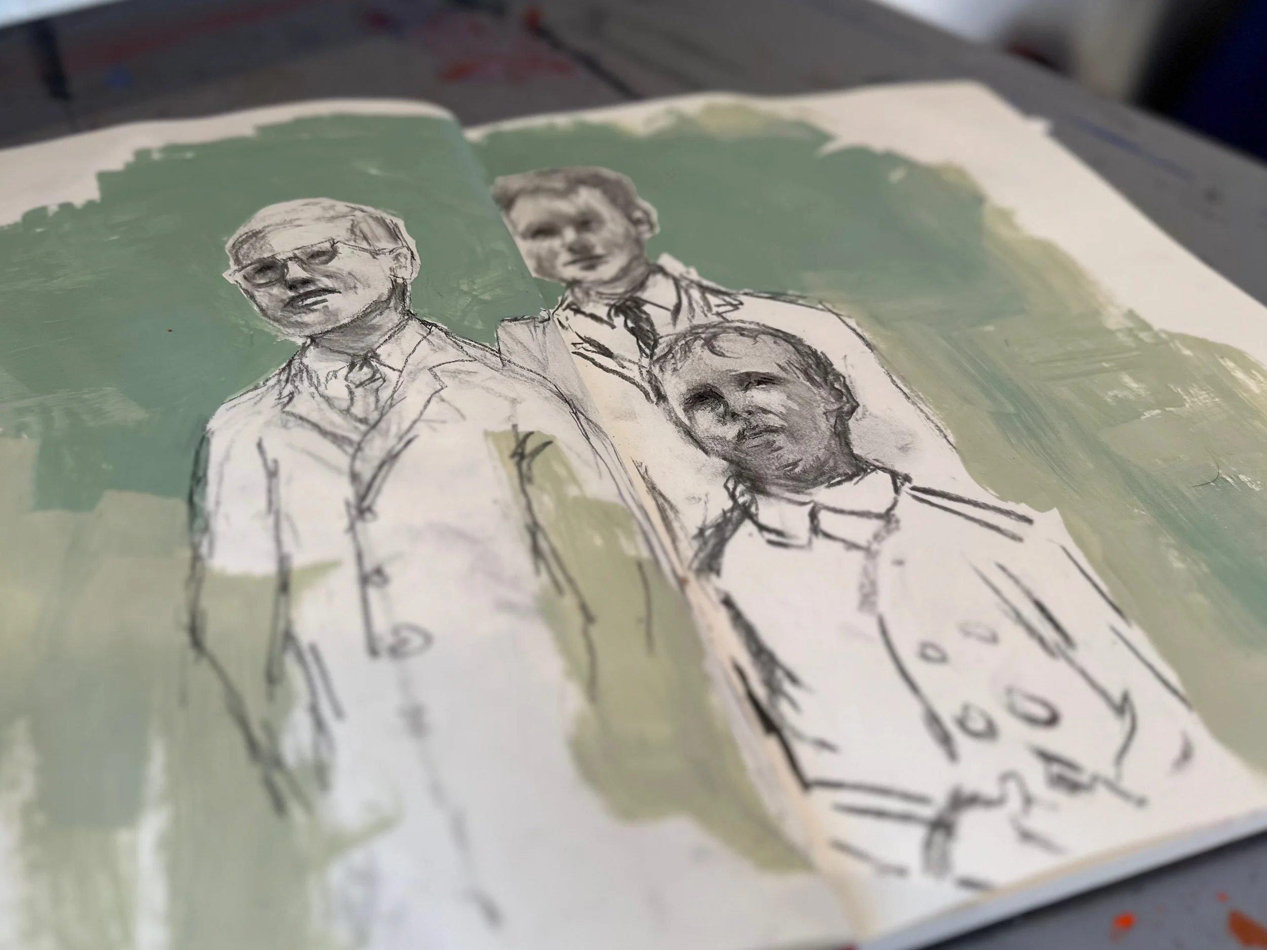 Sketch of three people, likely family members, with a green background in an open sketchbook. The drawing is detailed with some color highlights.