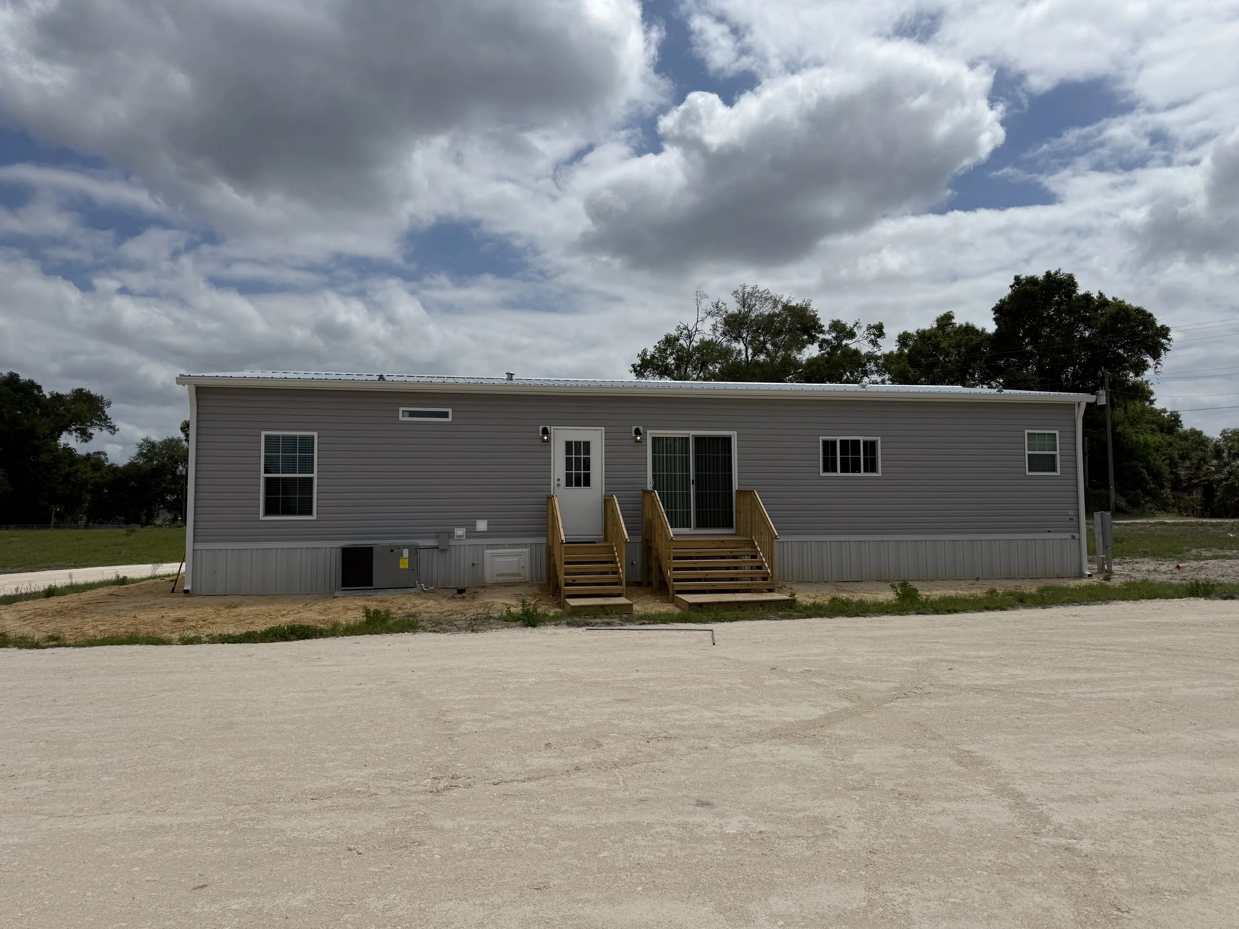 Seamless gutters and downspouts installed on mobile home in Chiefland, Florida