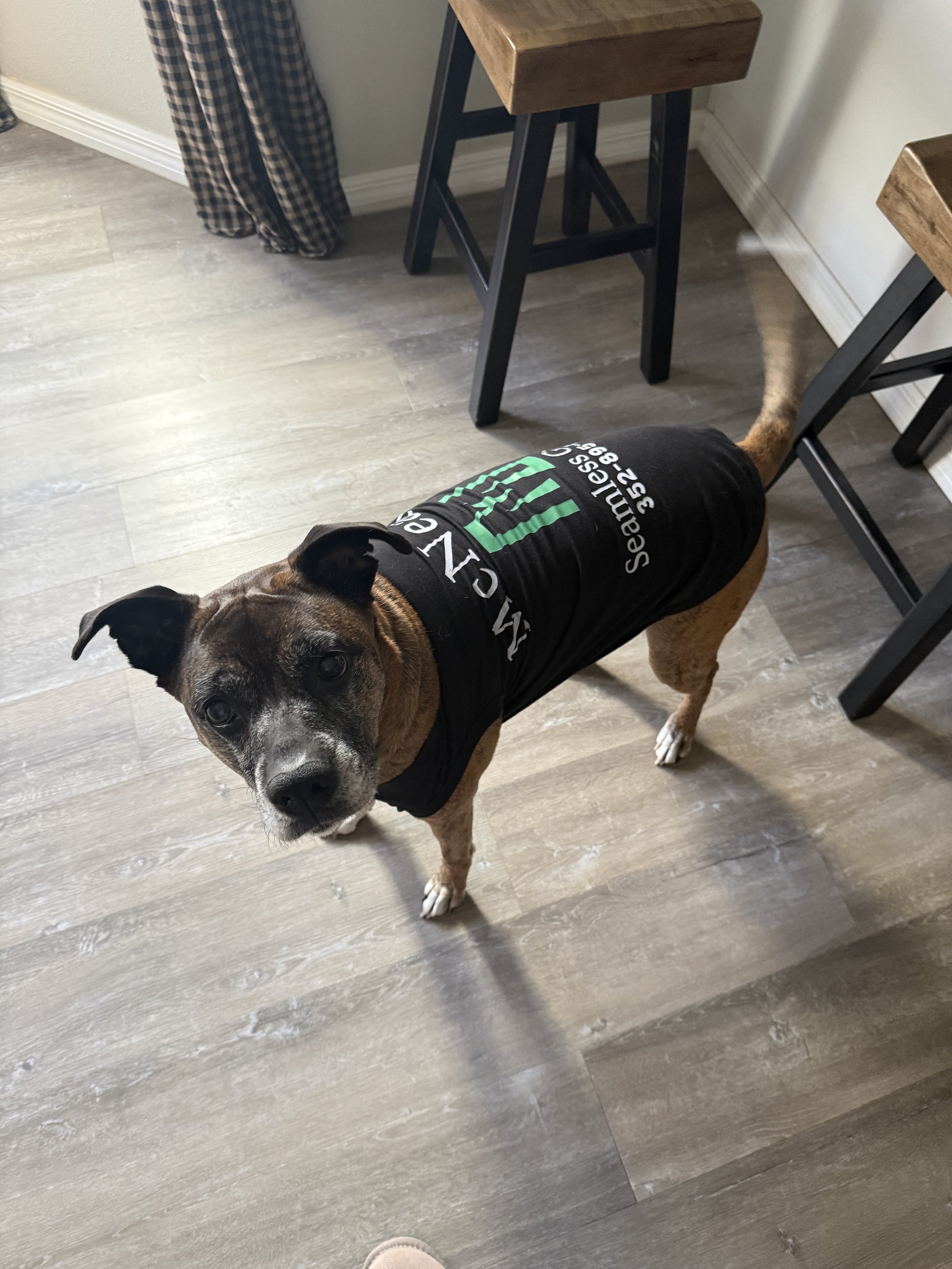 Woodrow wearing his McNeal’s Seamless Gutters shirt.